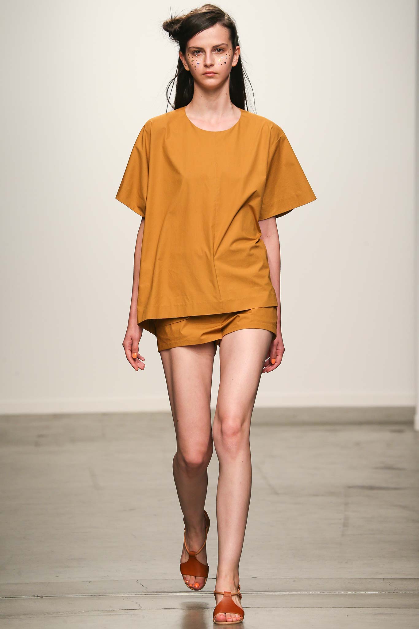 A relaxed brown cotton top with short sleeves paired with matching shorts.