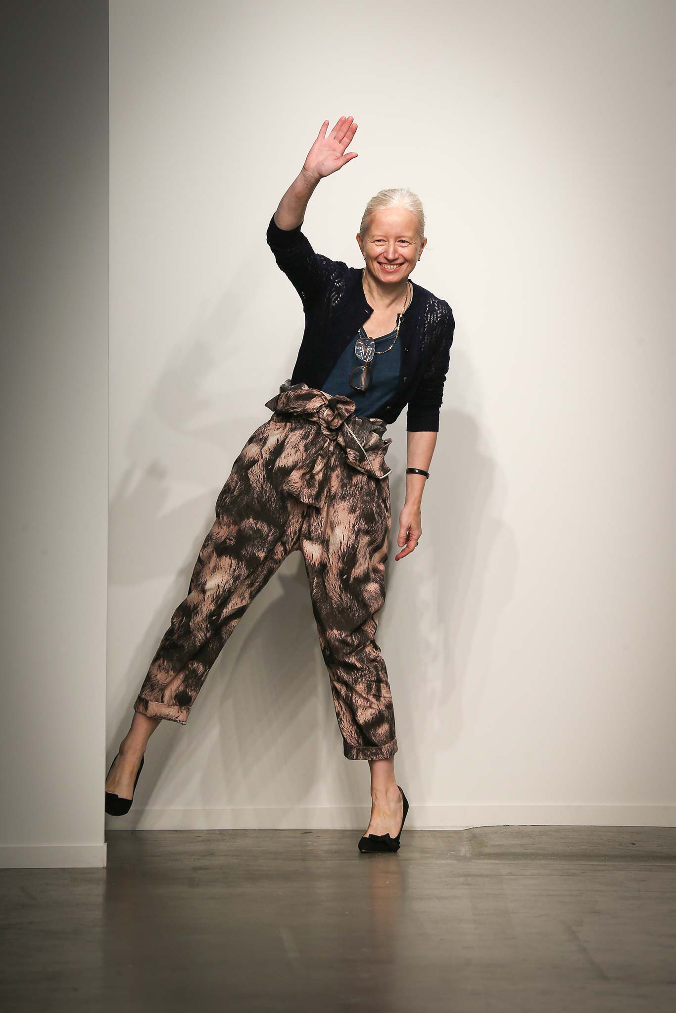 A relaxed outfit featuring multicolor printed pants and a sleeveless top.