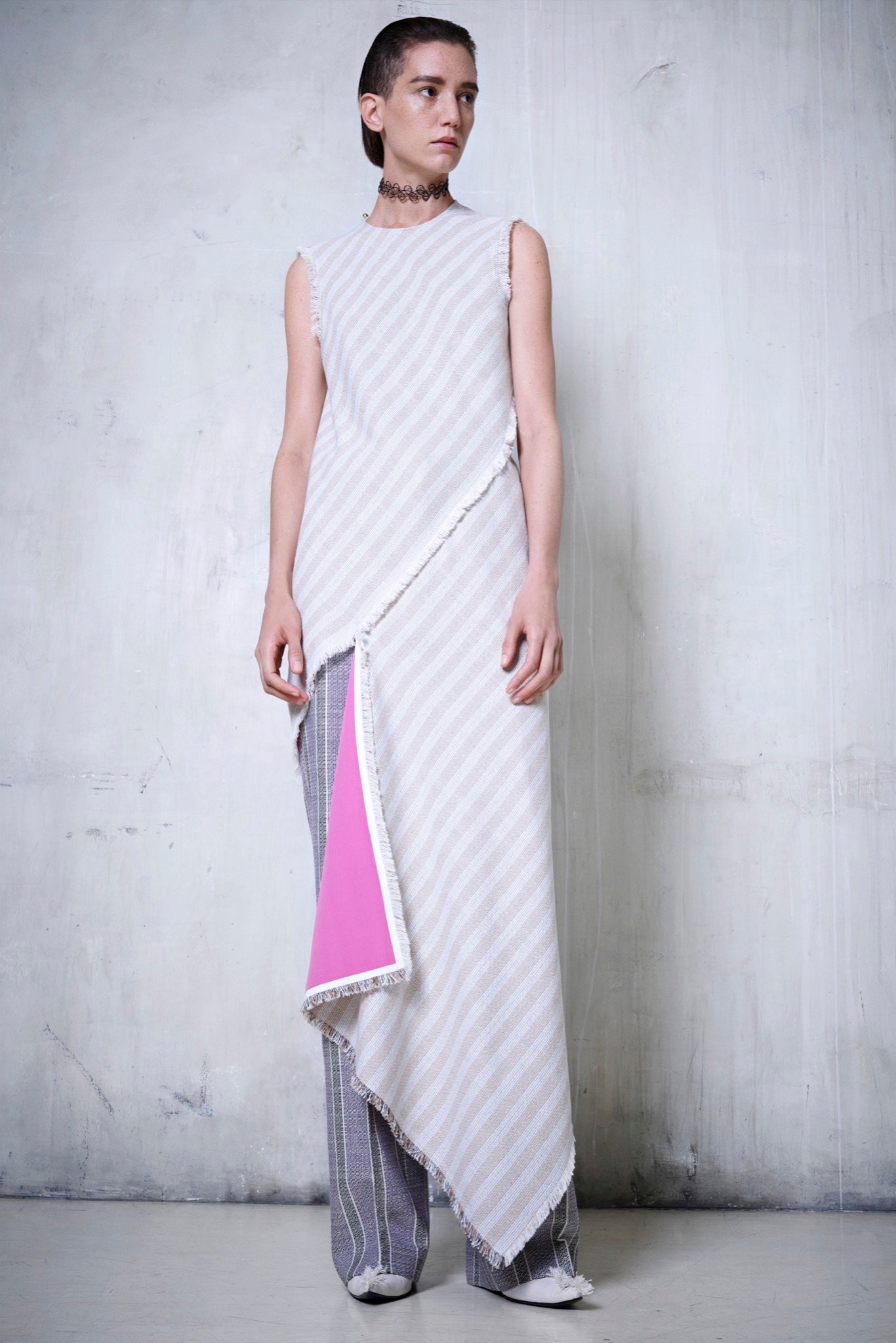 white striped asymmetric dress with gray pants