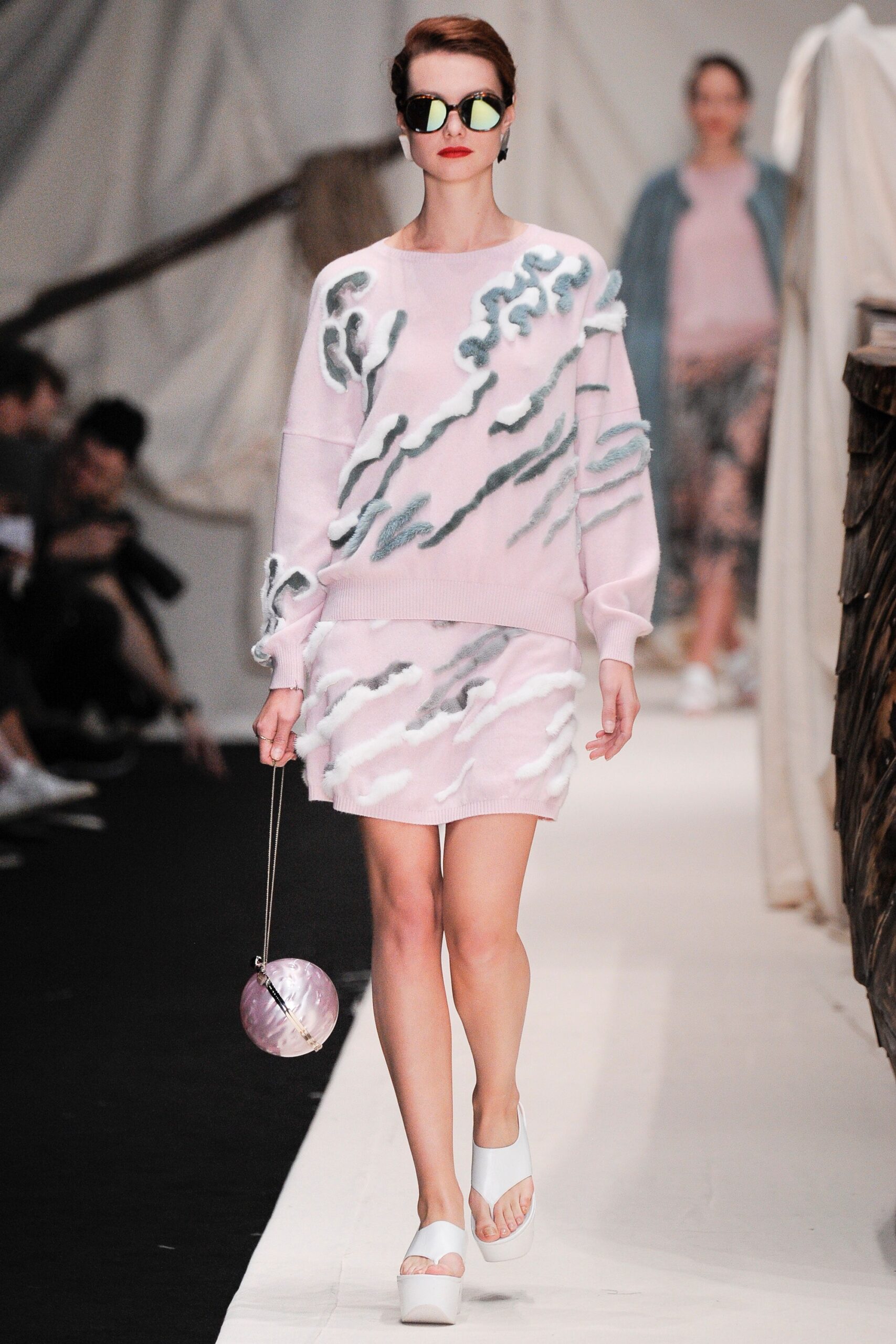 pink embroidered sweater and mini skirt