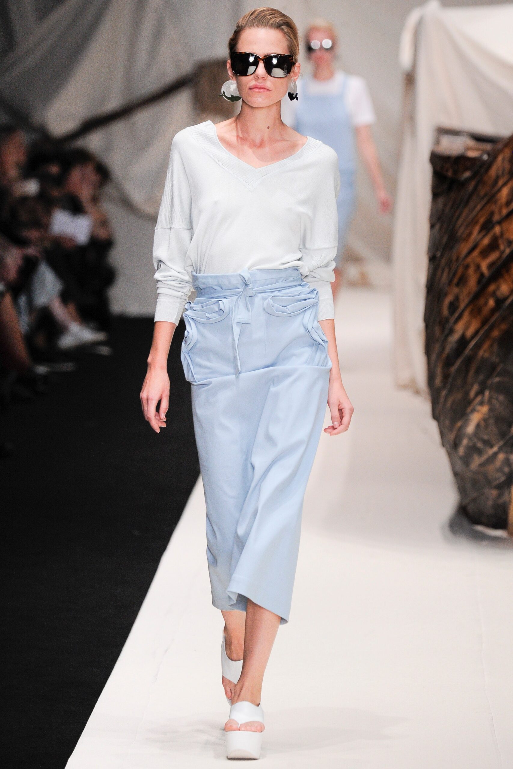 white relaxed top with blue skirt
