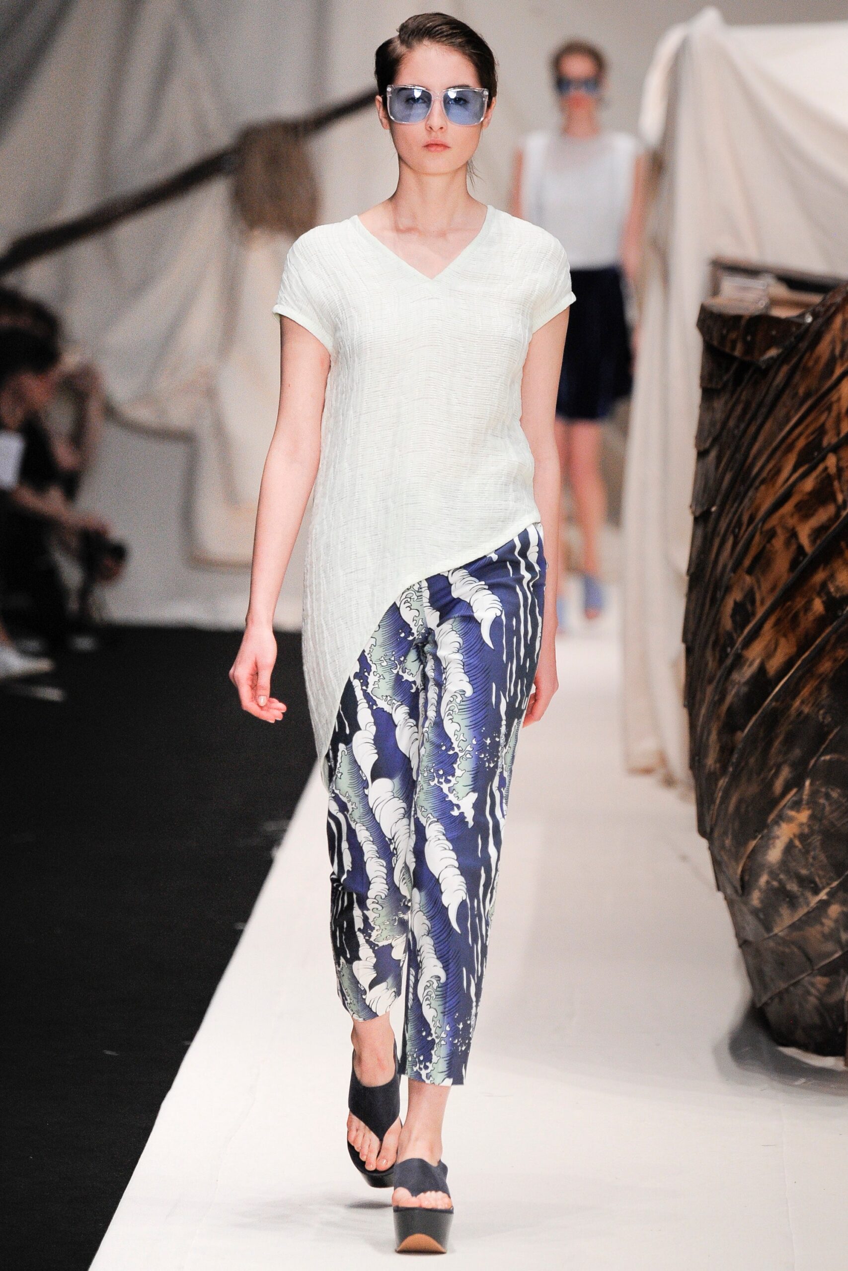 white relaxed top with blue printed pants