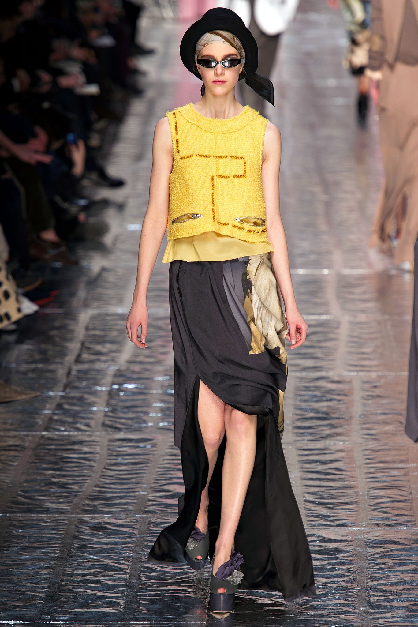 yellow embellished sleeveless top and black skirt