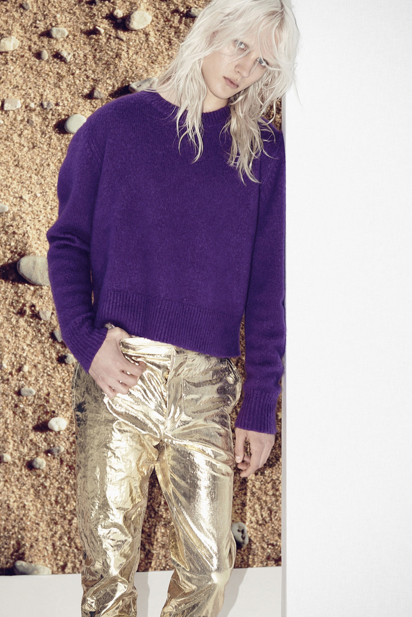 purple cropped sweater and gold pants