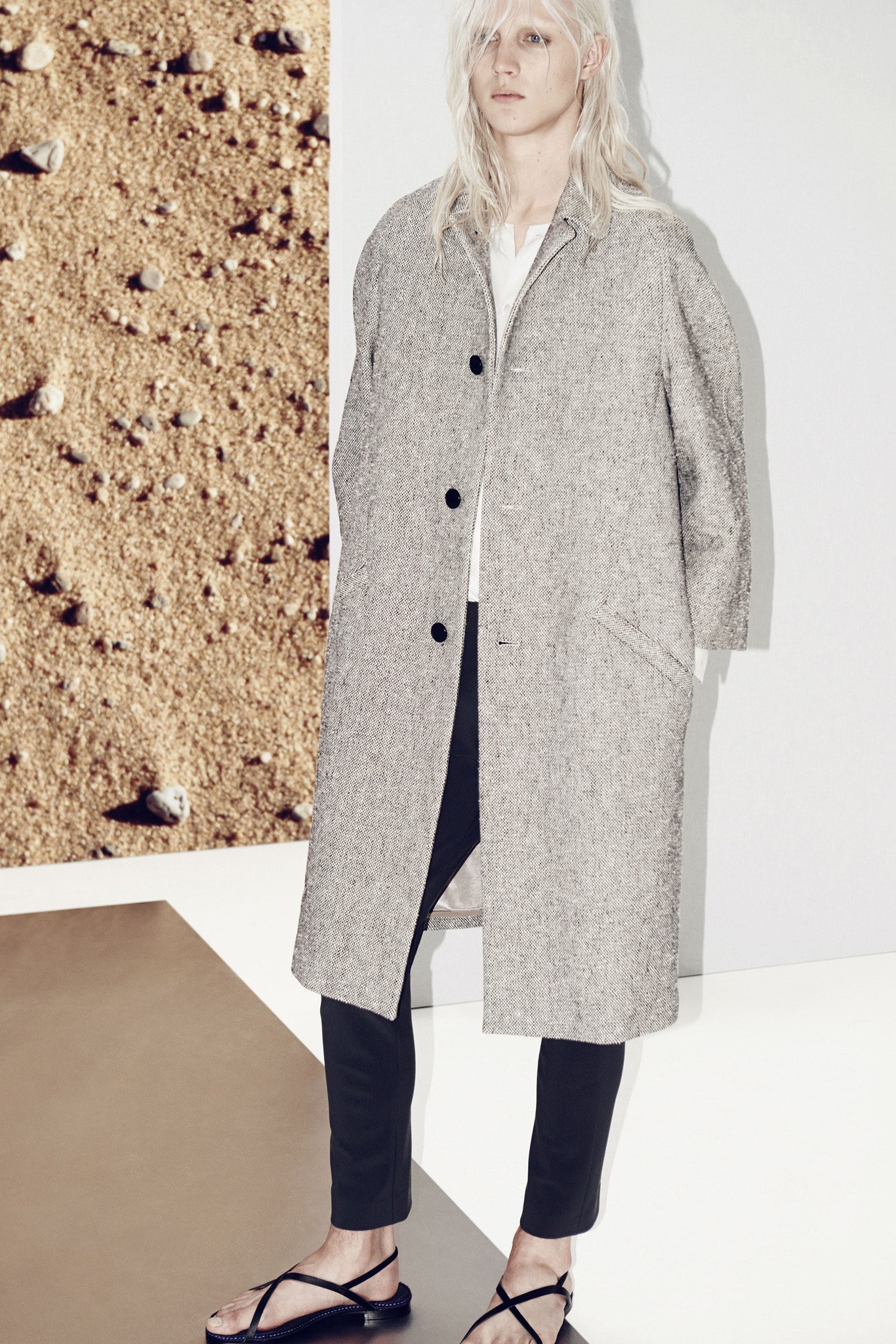 beige wool relaxed coat with black pants