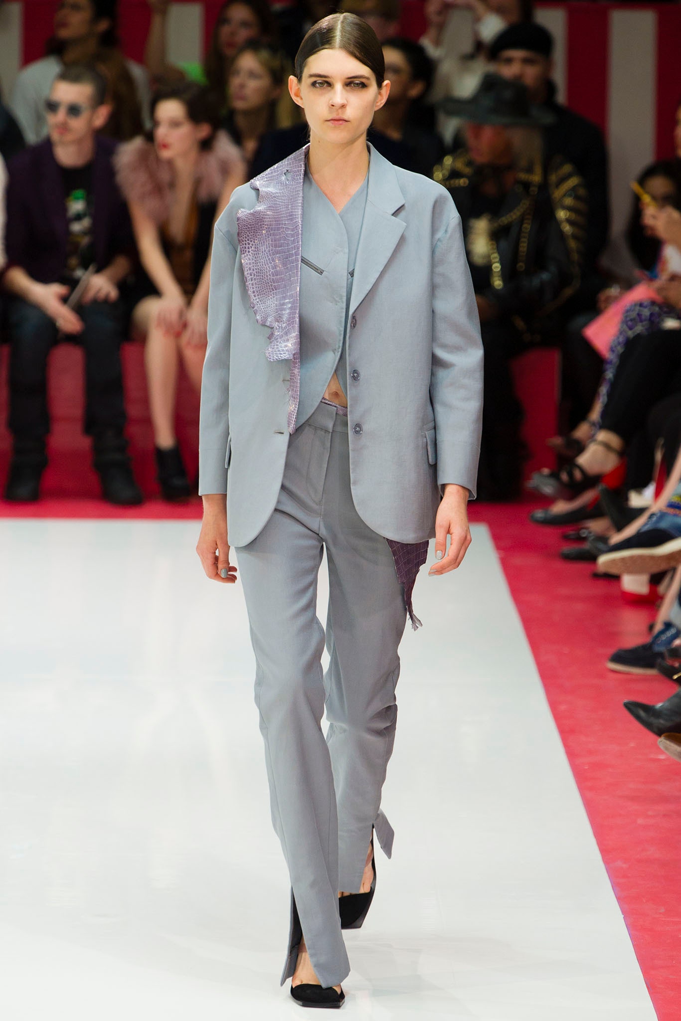 blue tailored suit with asymmetric detail