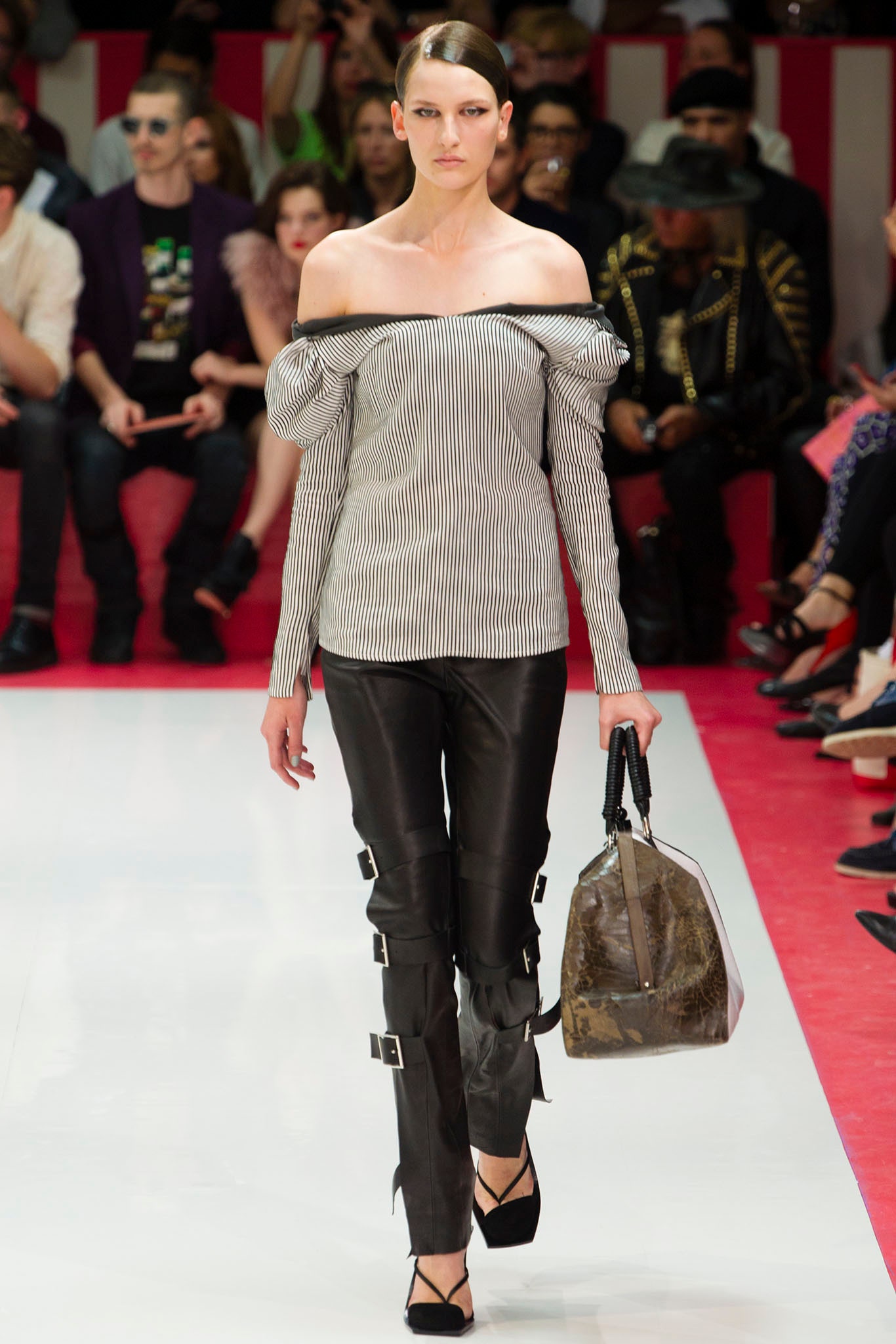off-shoulder striped top with leather pants