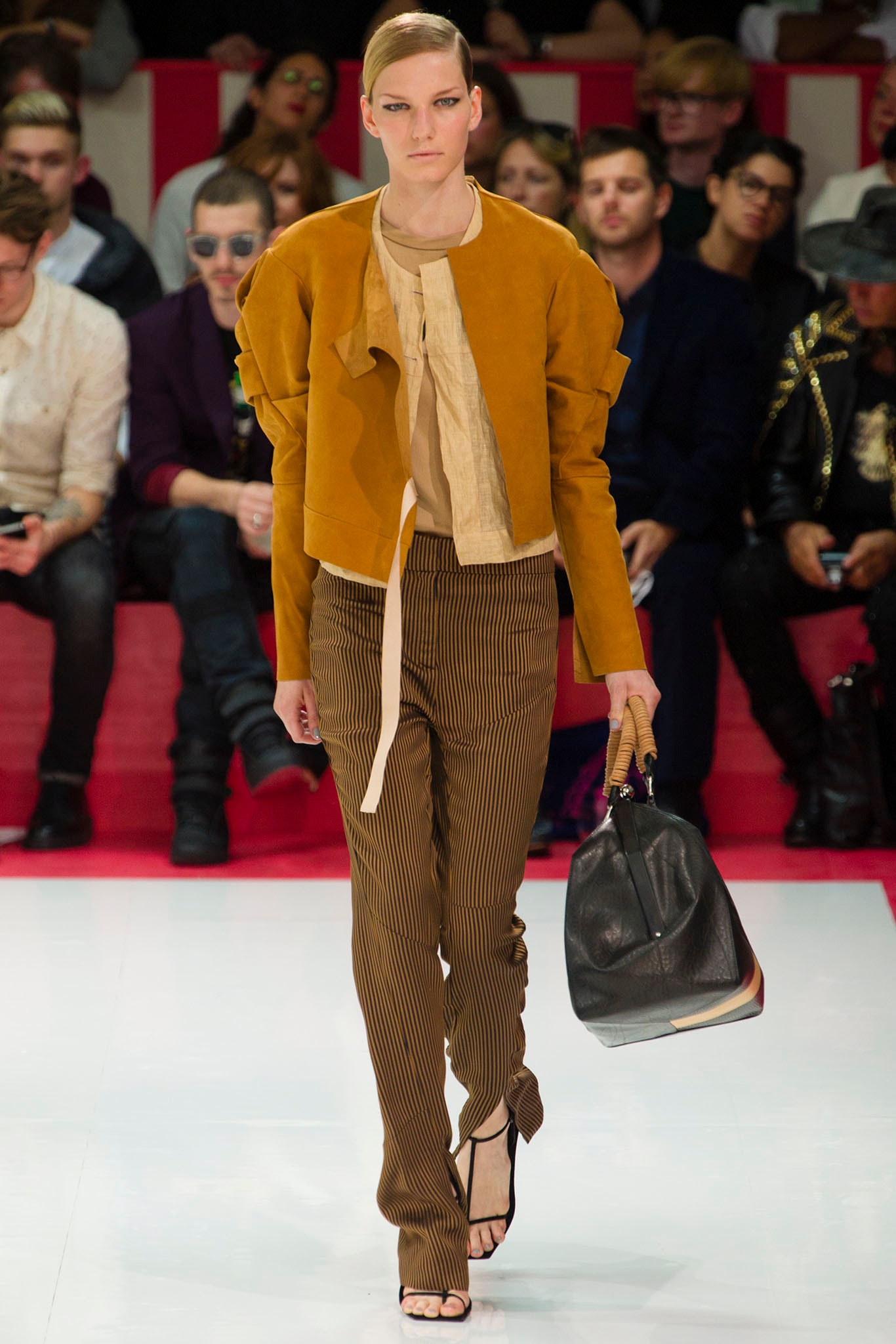 fitted orange suede jacket and brown striped pants