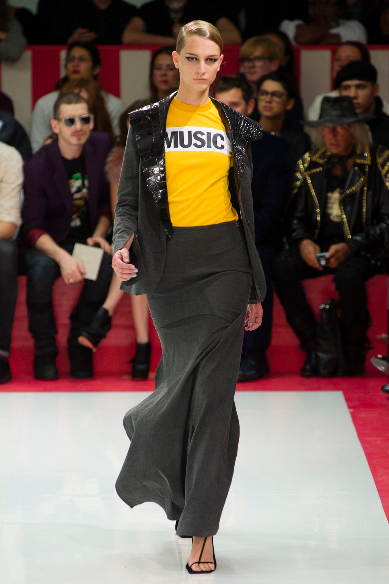 black blazer yellow top gray skirt