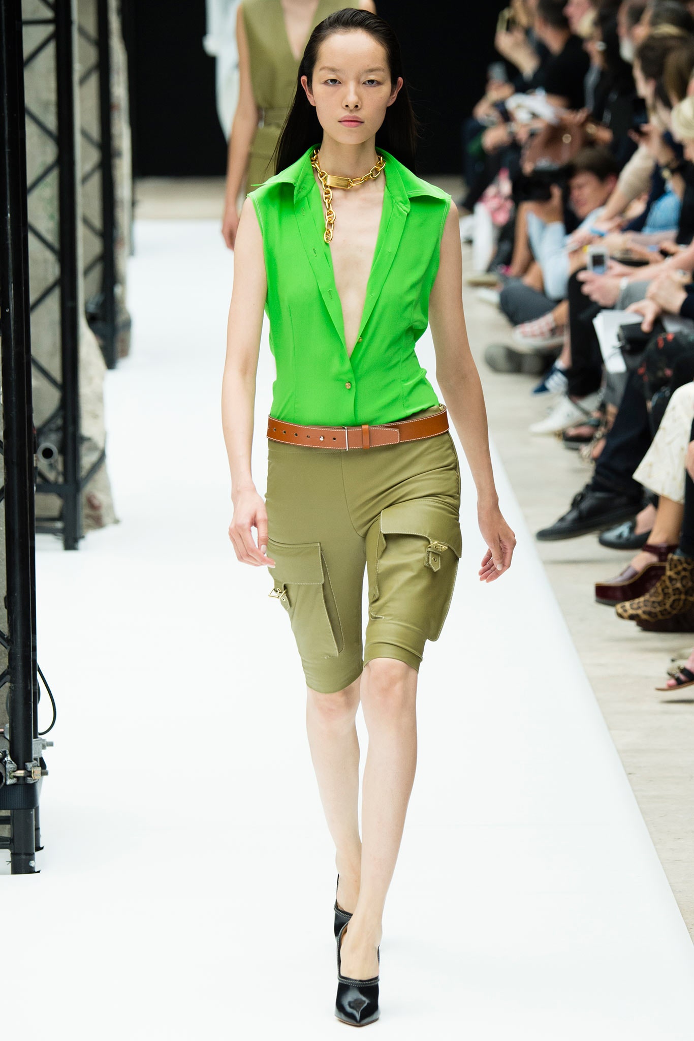 green fitted shirt with cargo shorts