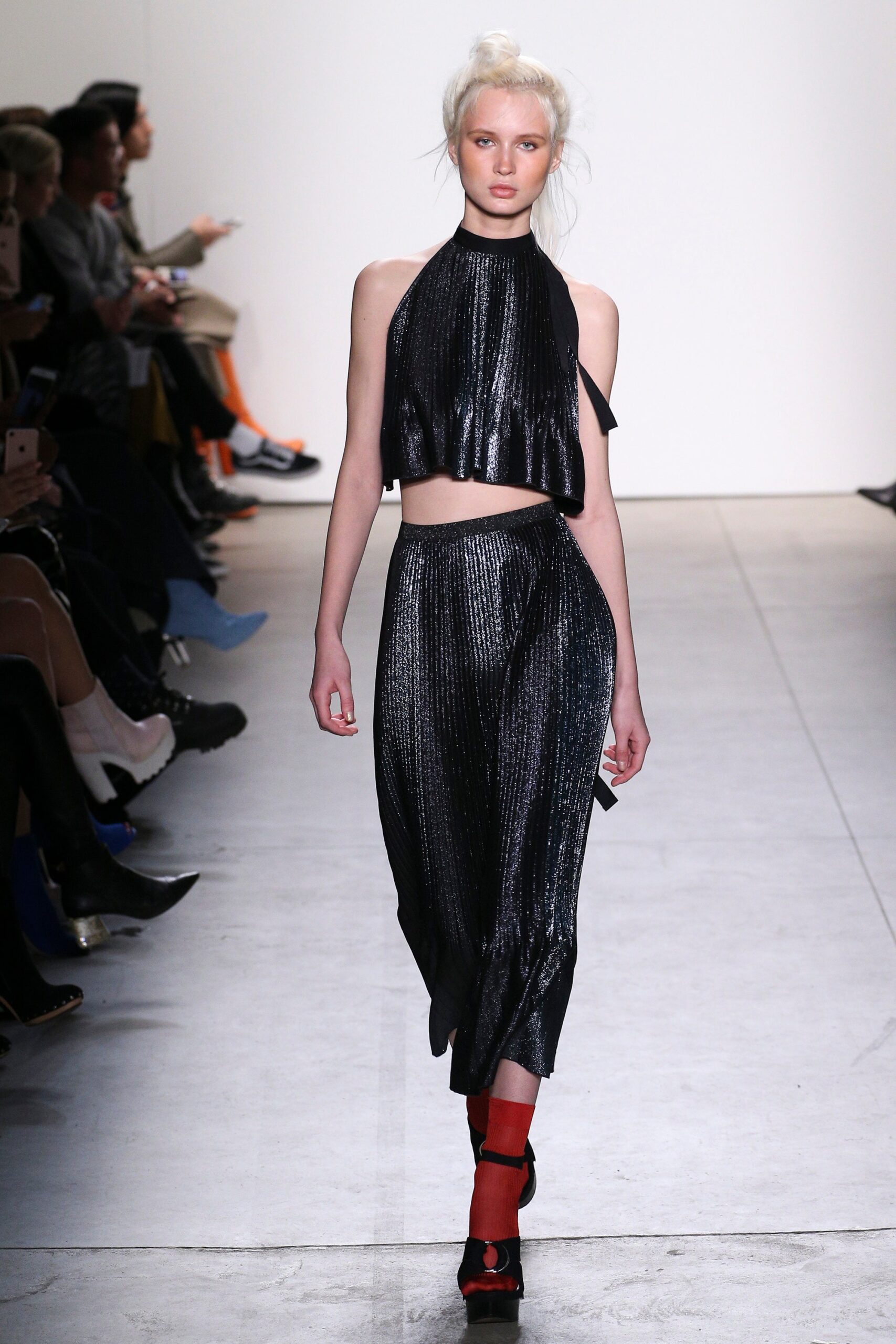 black pleated crop-top and skirt