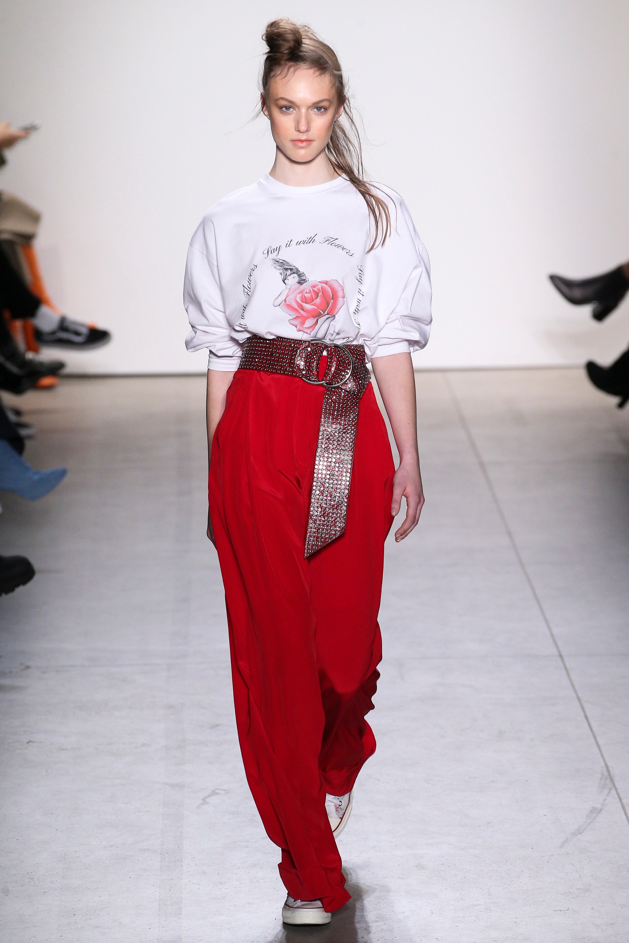 white relaxed top with red pants