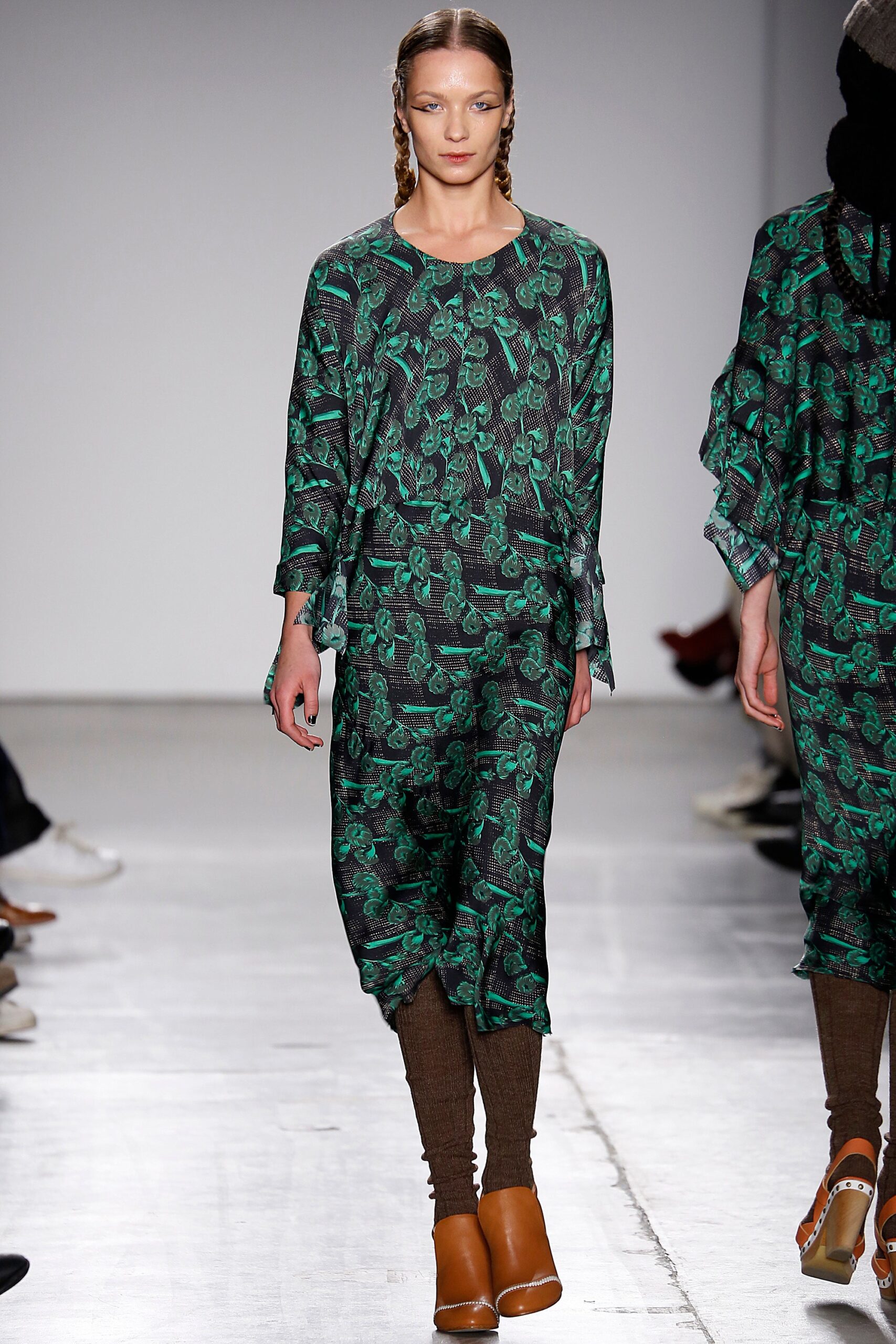 A relaxed green printed dress with long sleeves and a crew neckline.