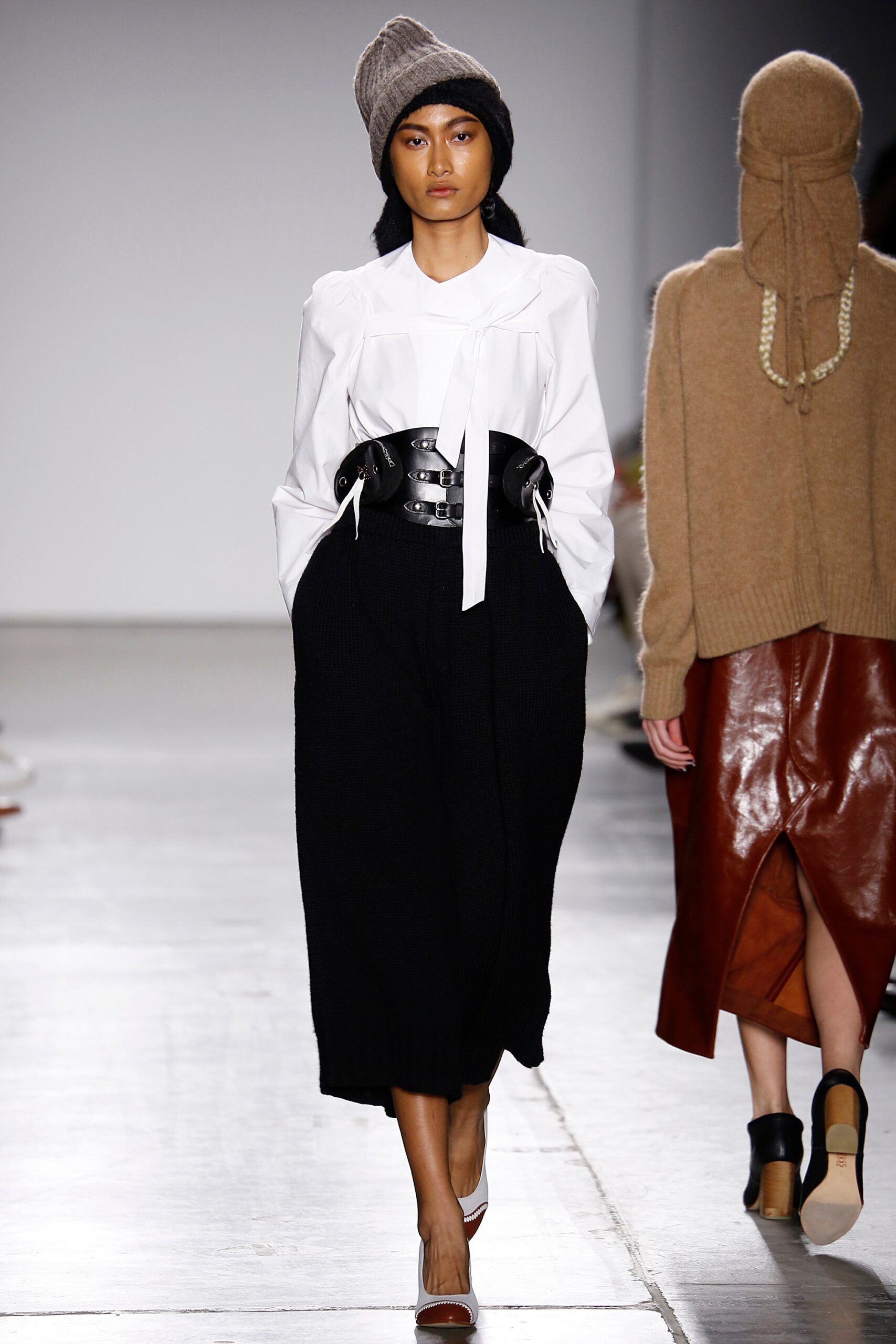 white shirt black pleated skirt