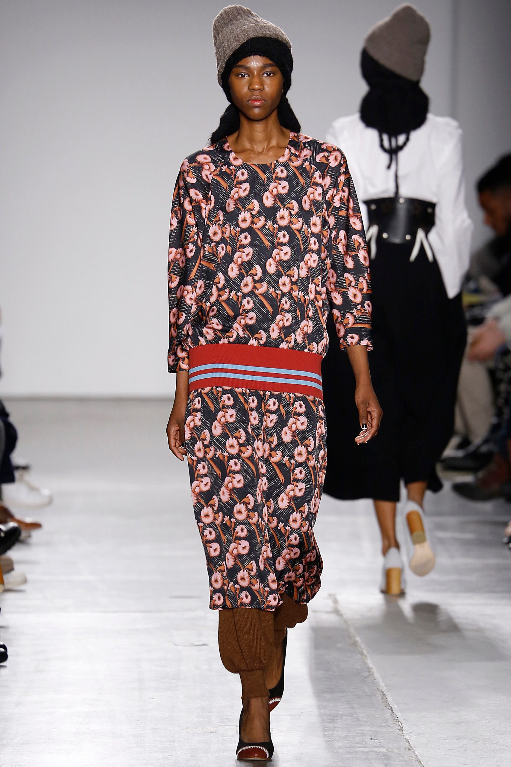 A relaxed multicolor printed dress with long sleeves and a collared neckline.