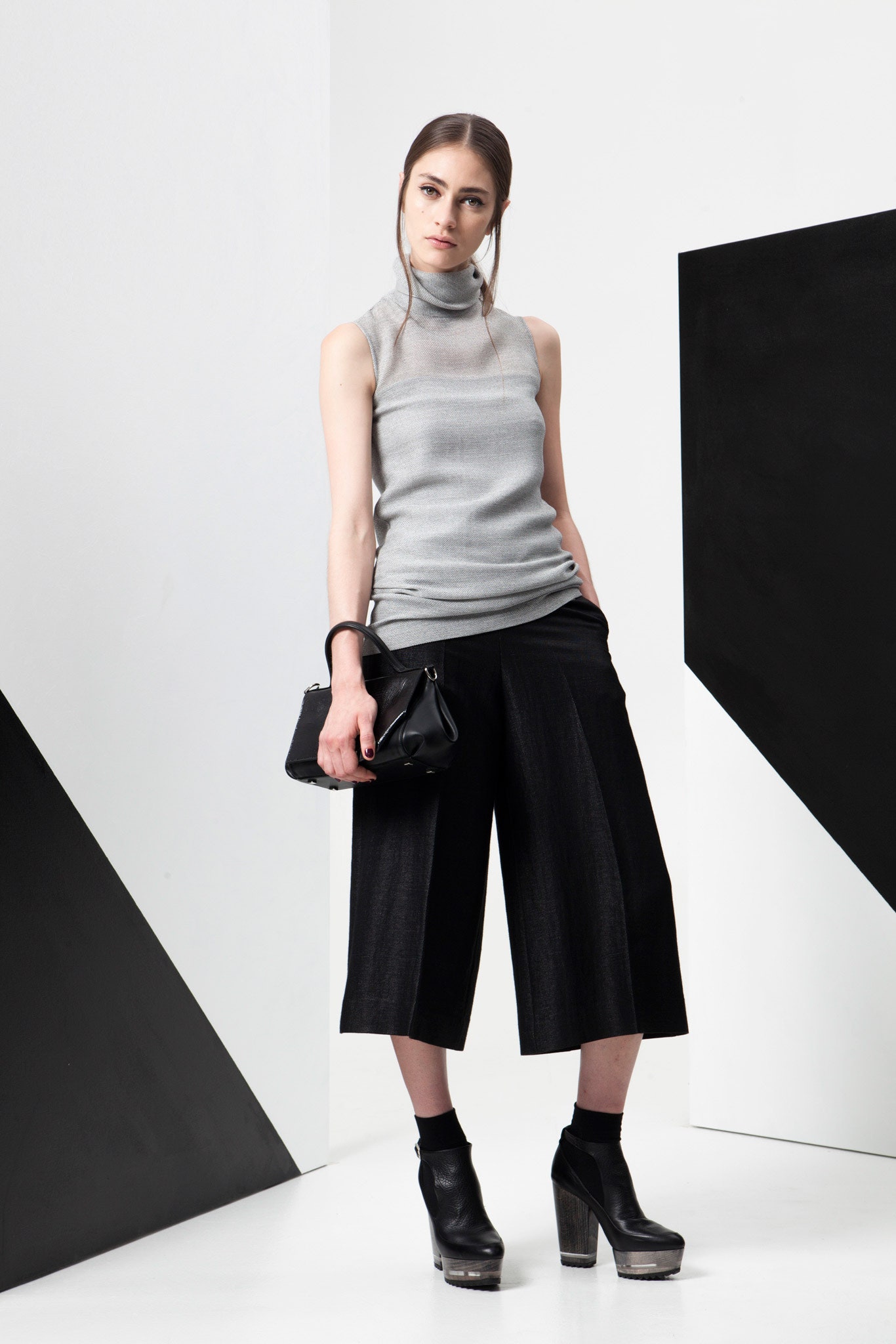 gray fitted sleeveless top with black culottes