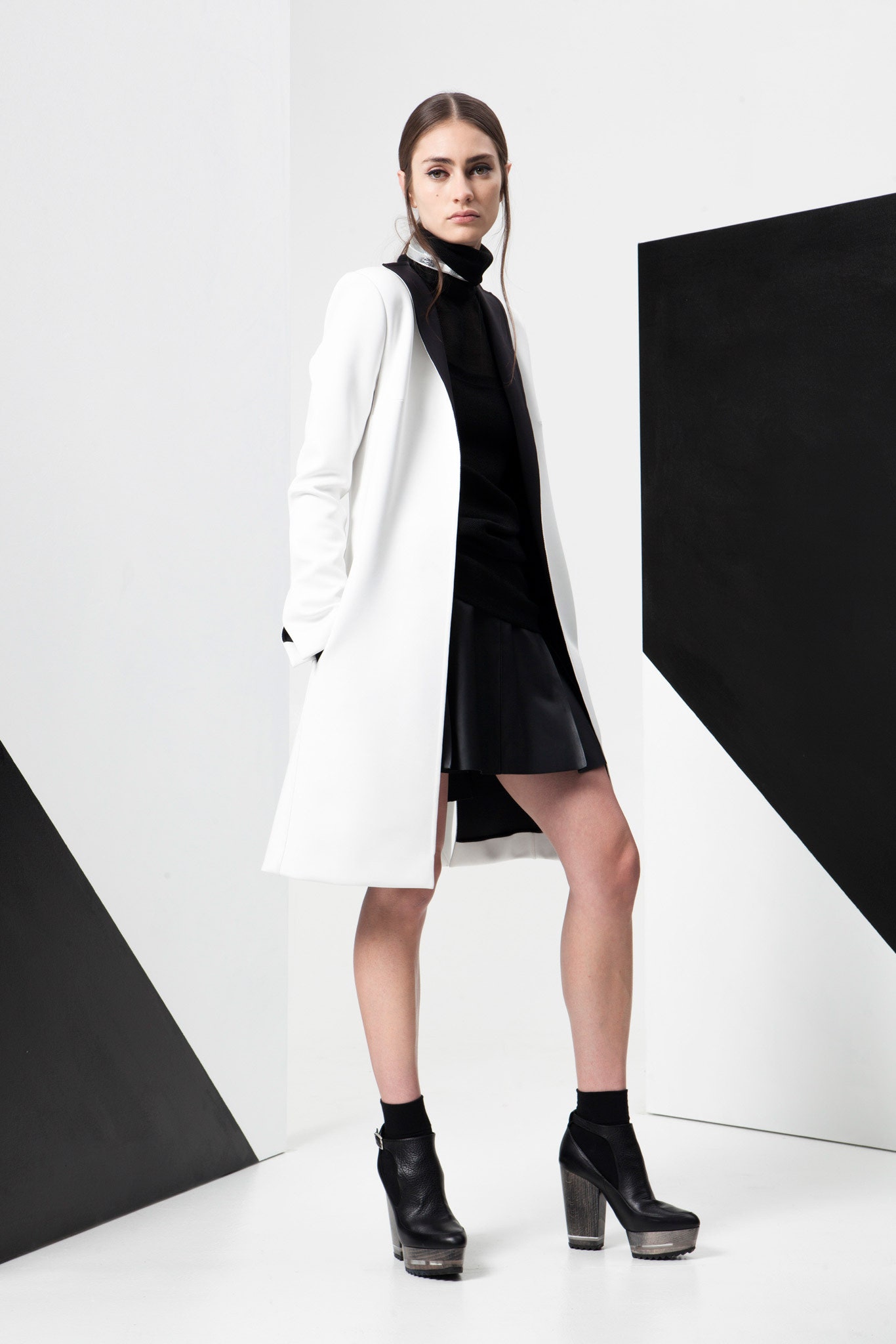 white coat black top leather skirt