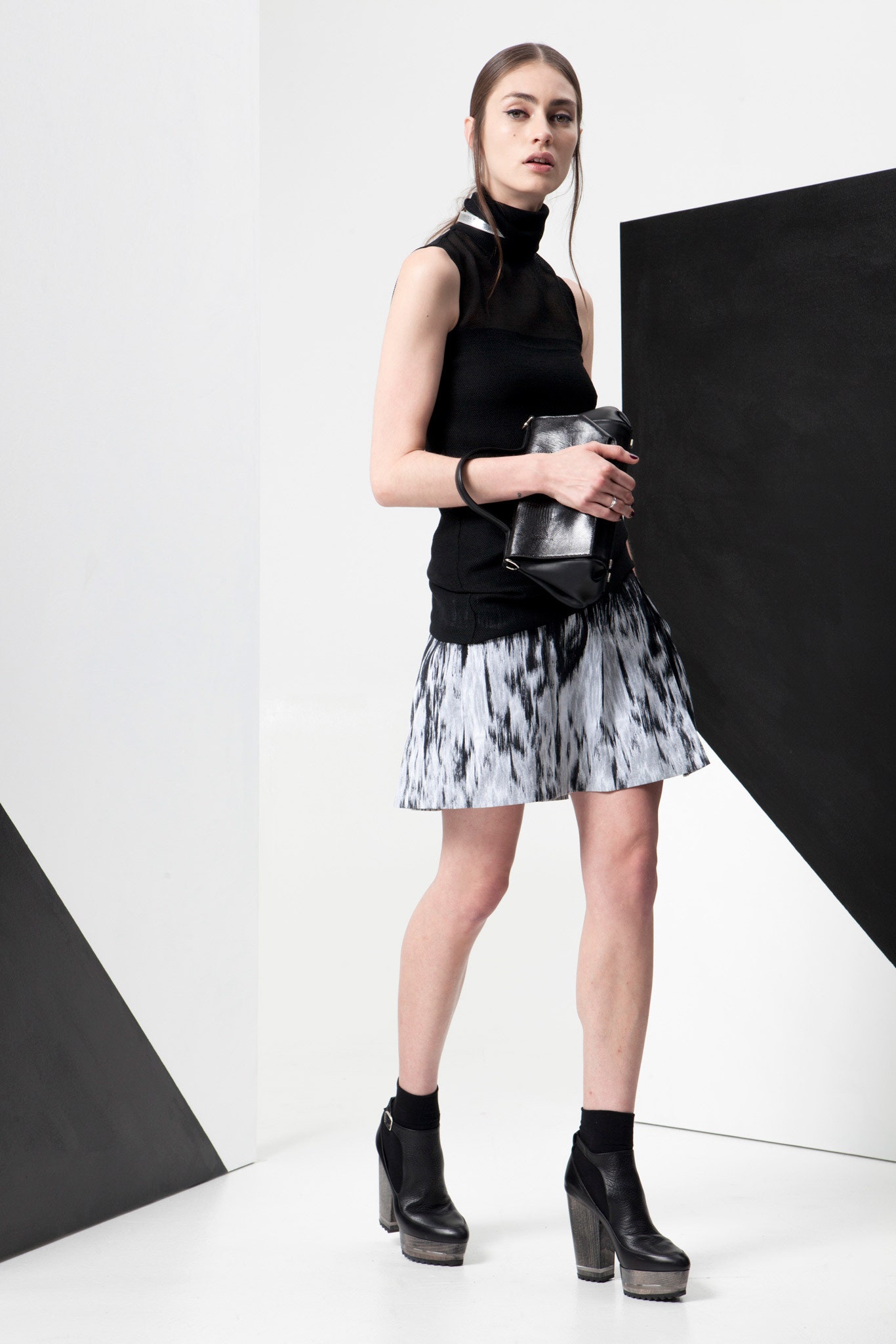 black fitted top with pleated skirt