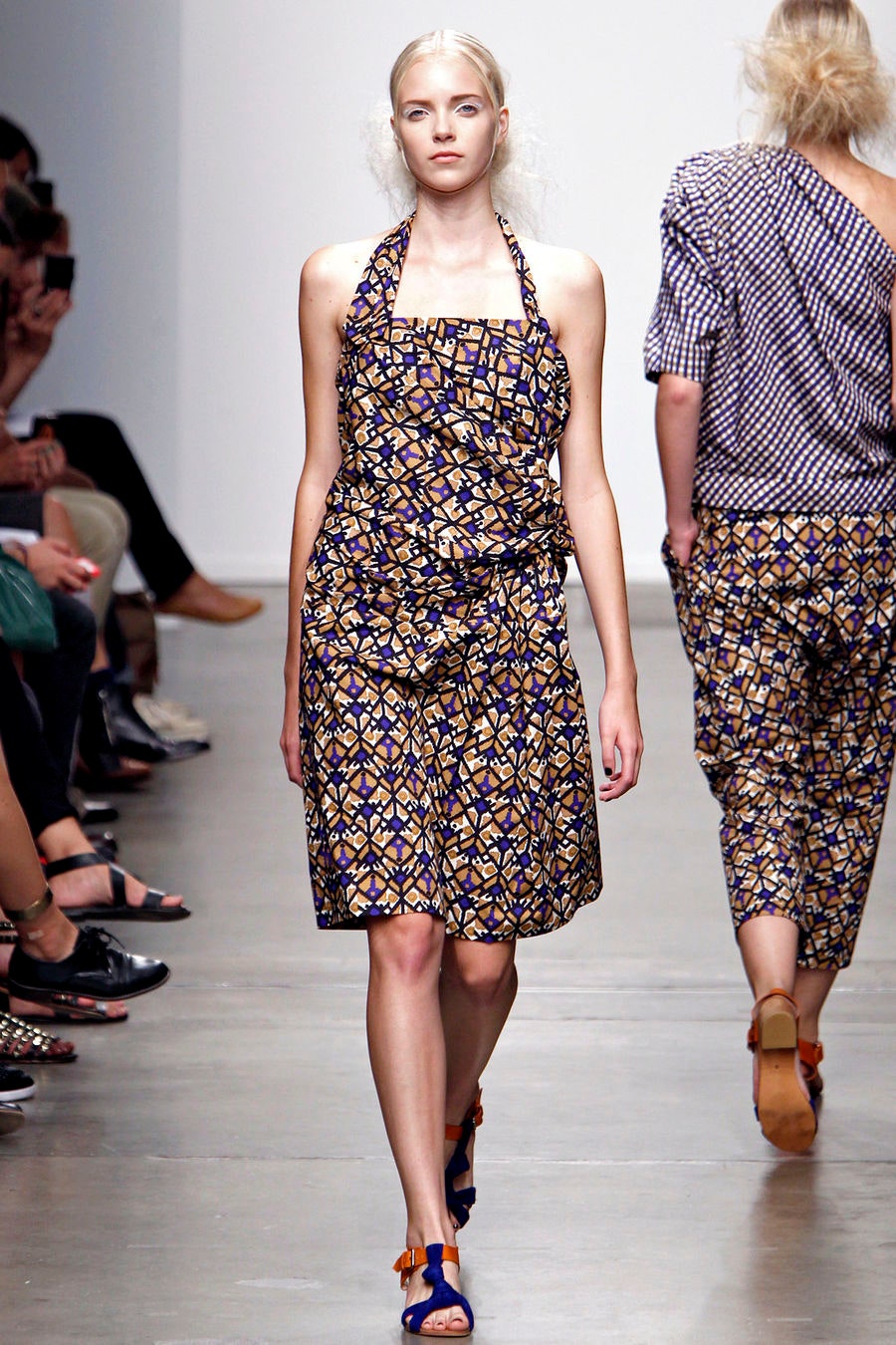 A fitted multicolor cotton sleeveless dress with a halter neckline and printed design.