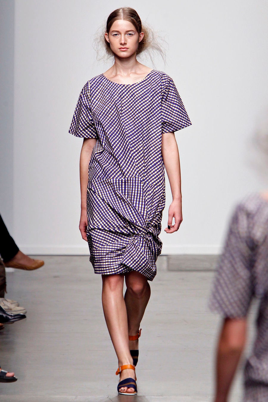 A relaxed purple and white striped dress with short sleeves and an asymmetric design.