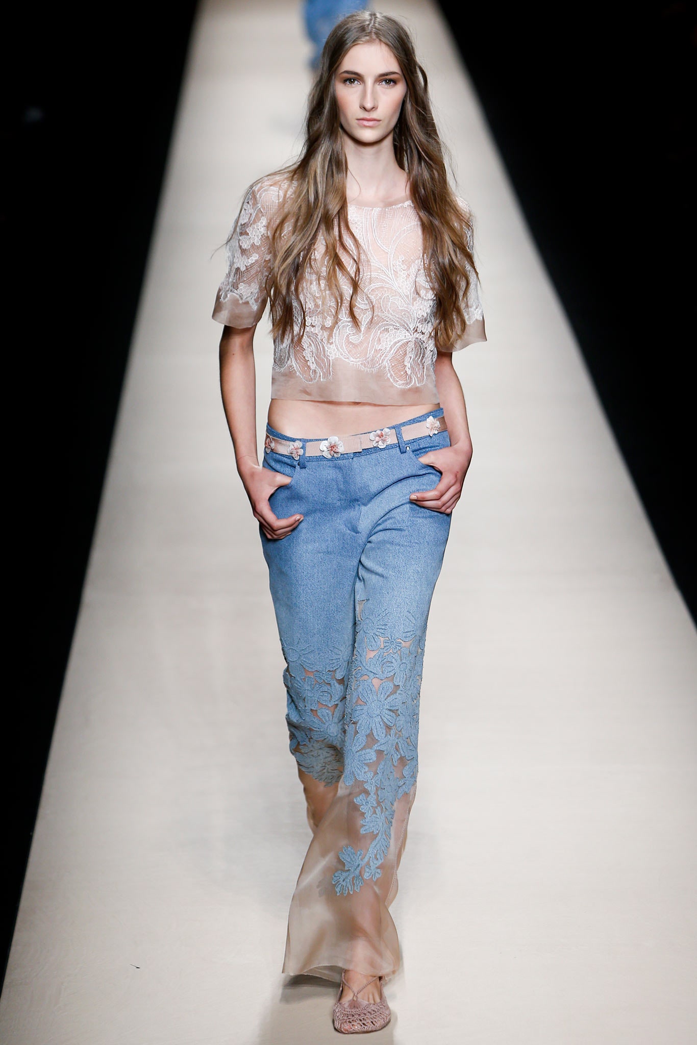 white lace fitted top and blue flared pants