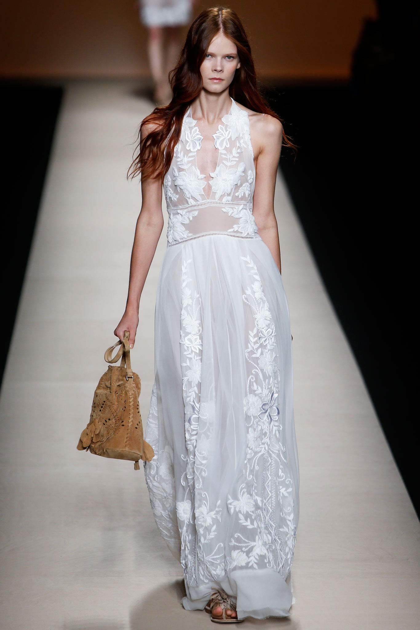 white embroidered sleeveless gown