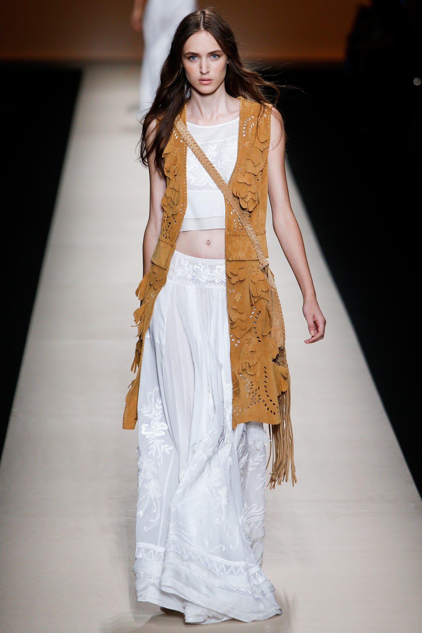 brown suede fringed vest with white top and skirt