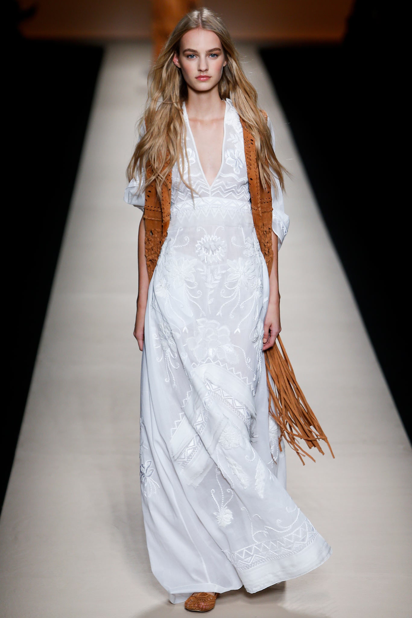 white embroidered maxi dress with brown fringed vest