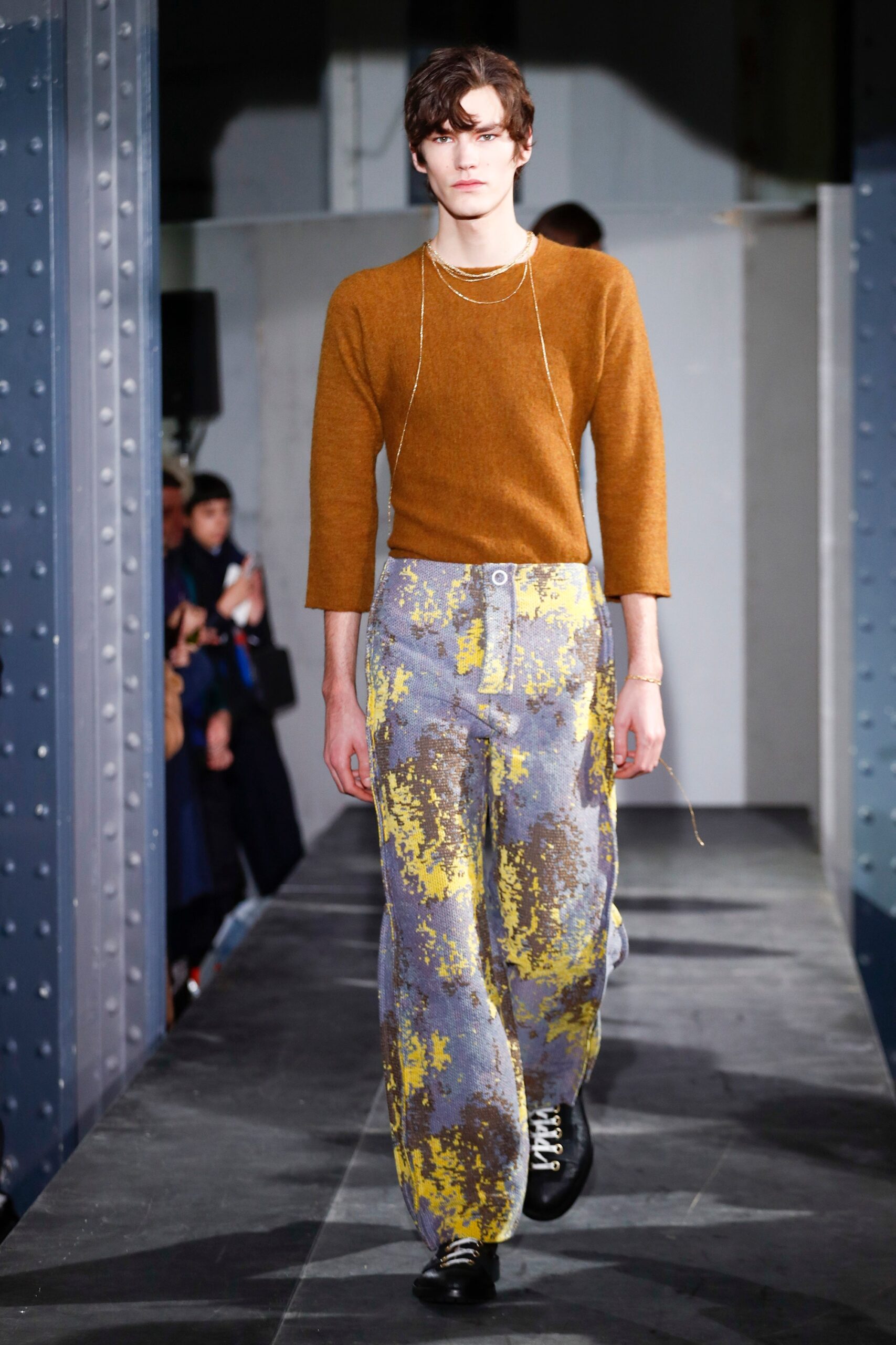 orange wool relaxed sweater and gray pants
