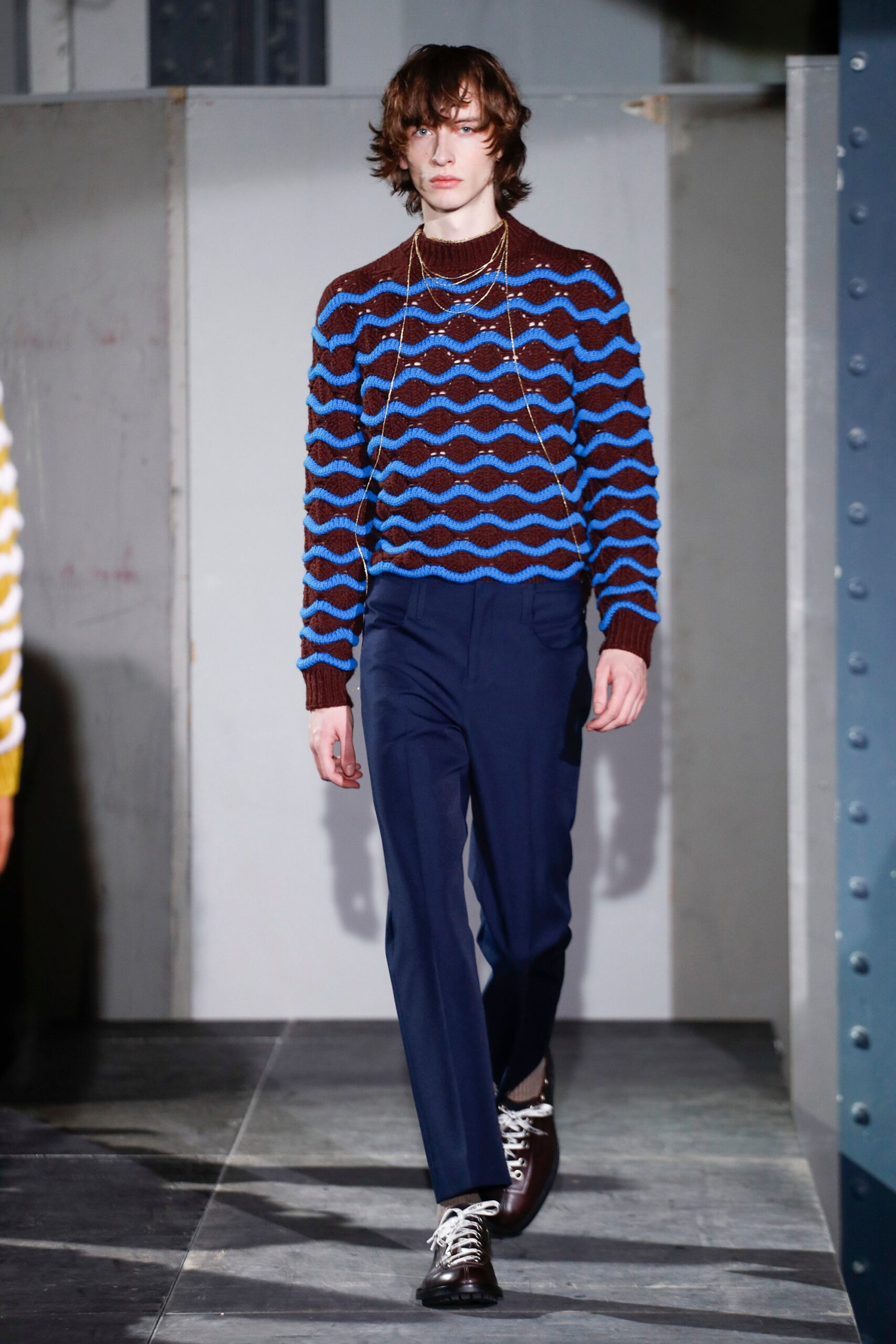 brown and blue striped sweater with tailored pants
