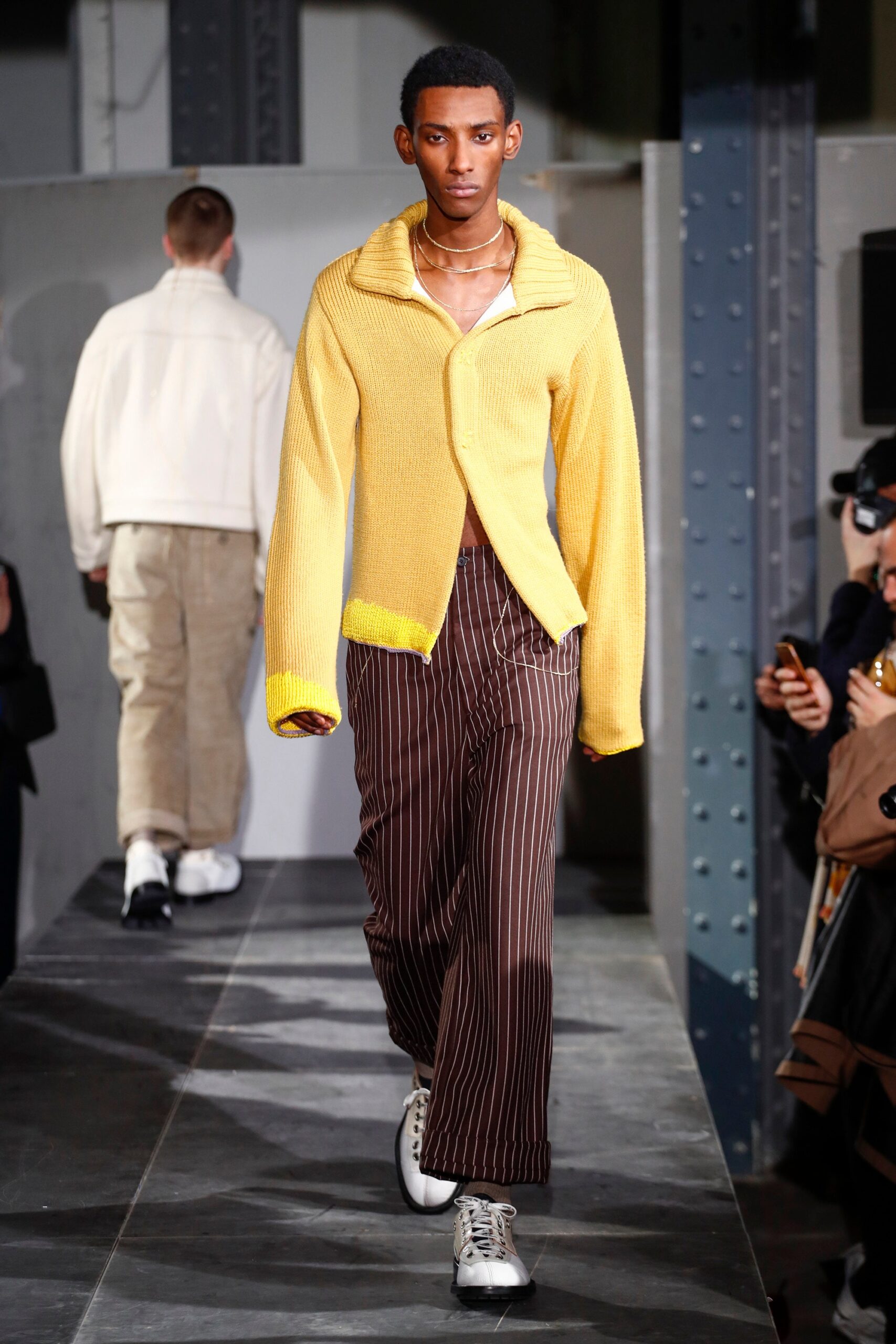 yellow relaxed sweater with striped pants