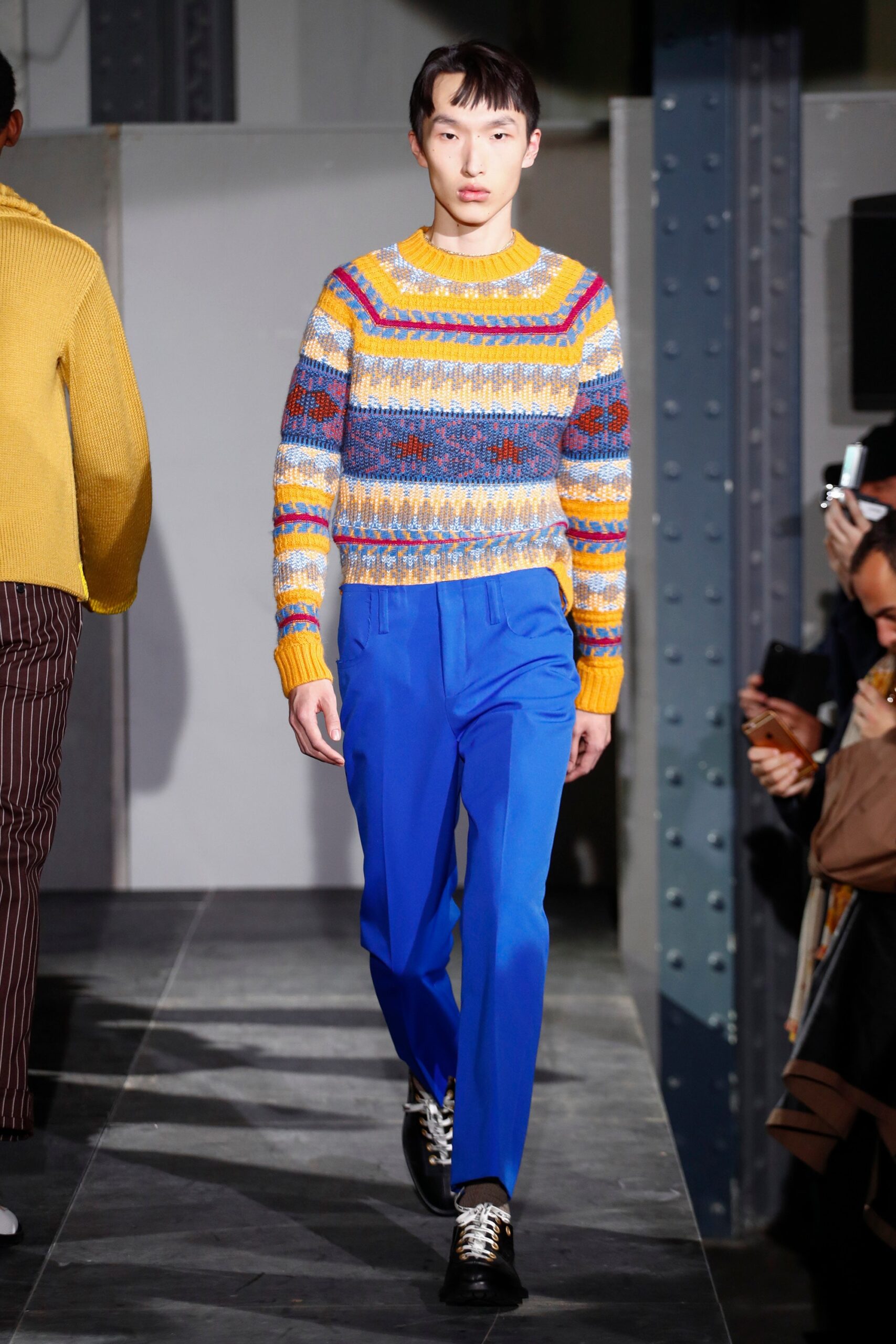 multi-colored wool sweater with blue pants