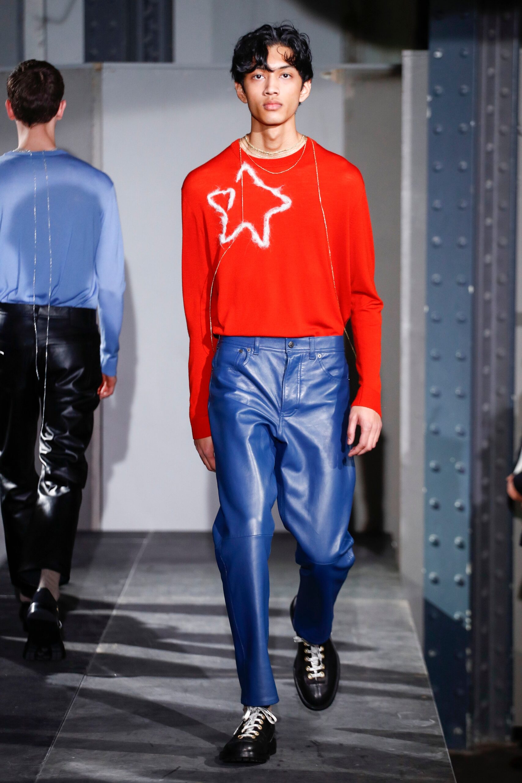 red fitted top blue leather pants