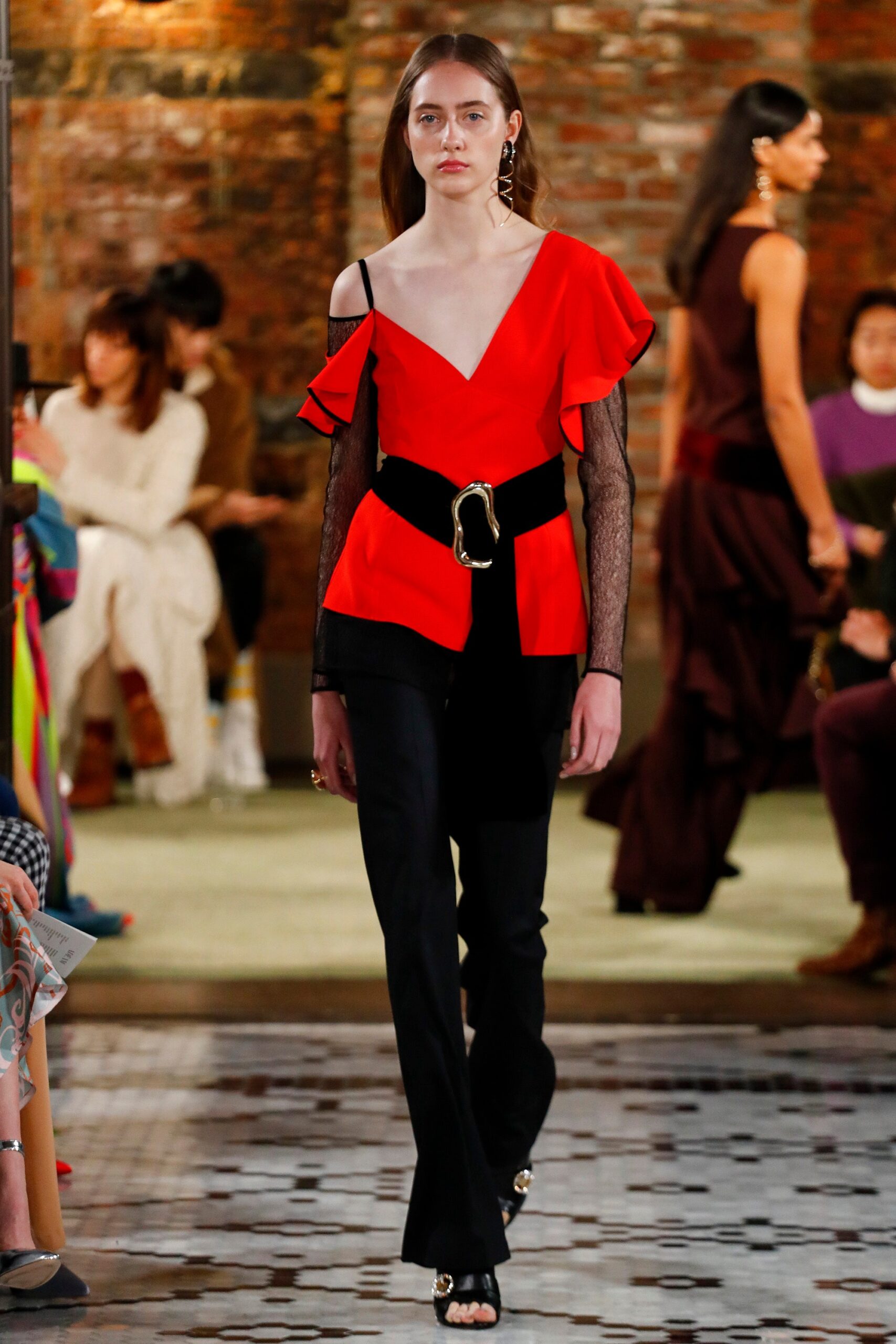 red sleeveless v-neck fitted ruffled belted top