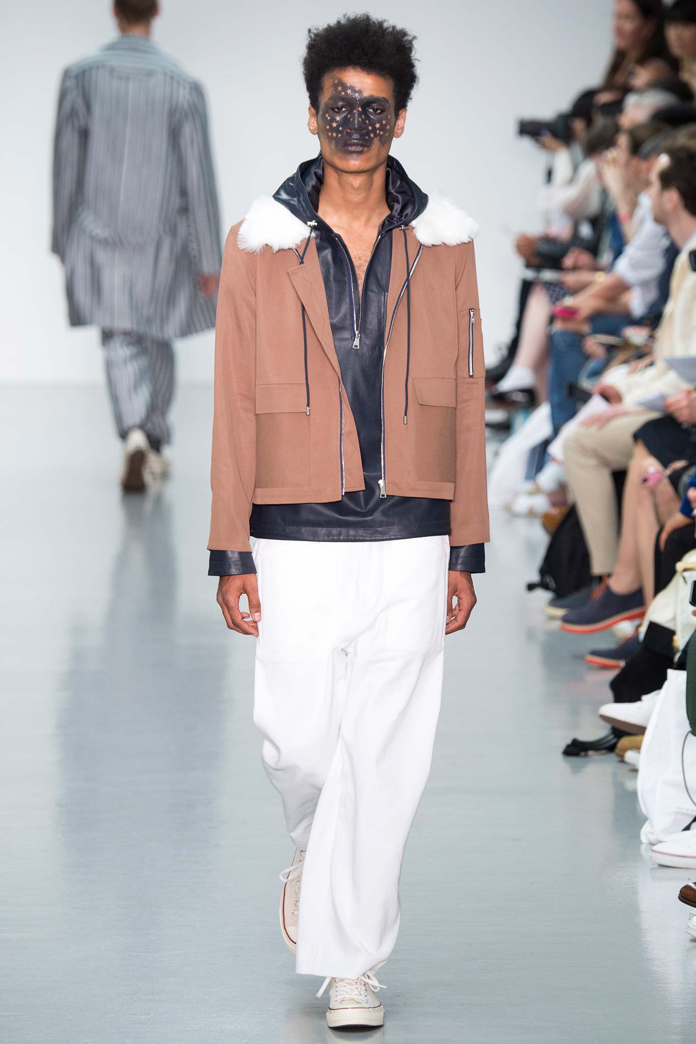 brown cotton relaxed jacket with white pants