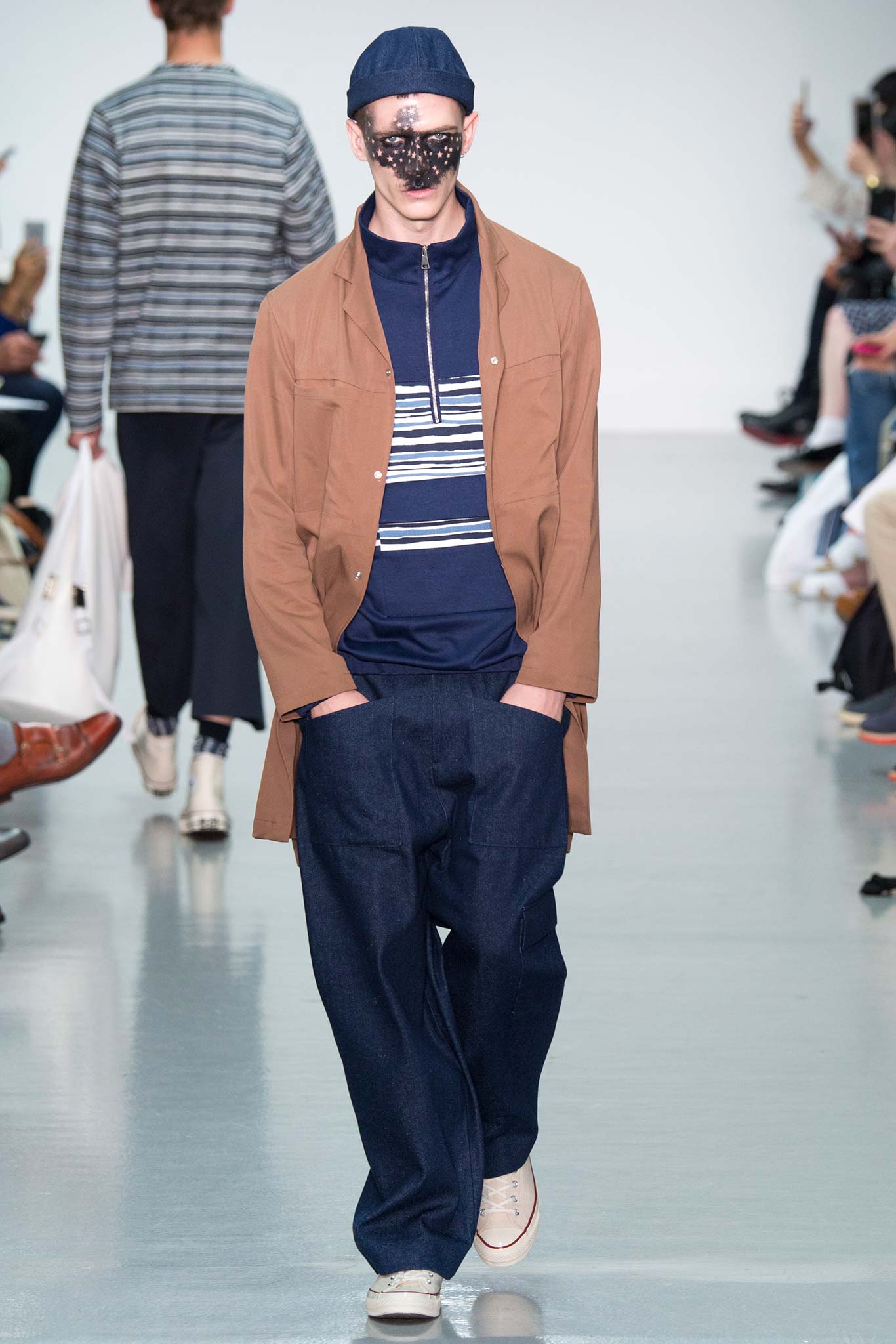 brown jacket with blue shirt