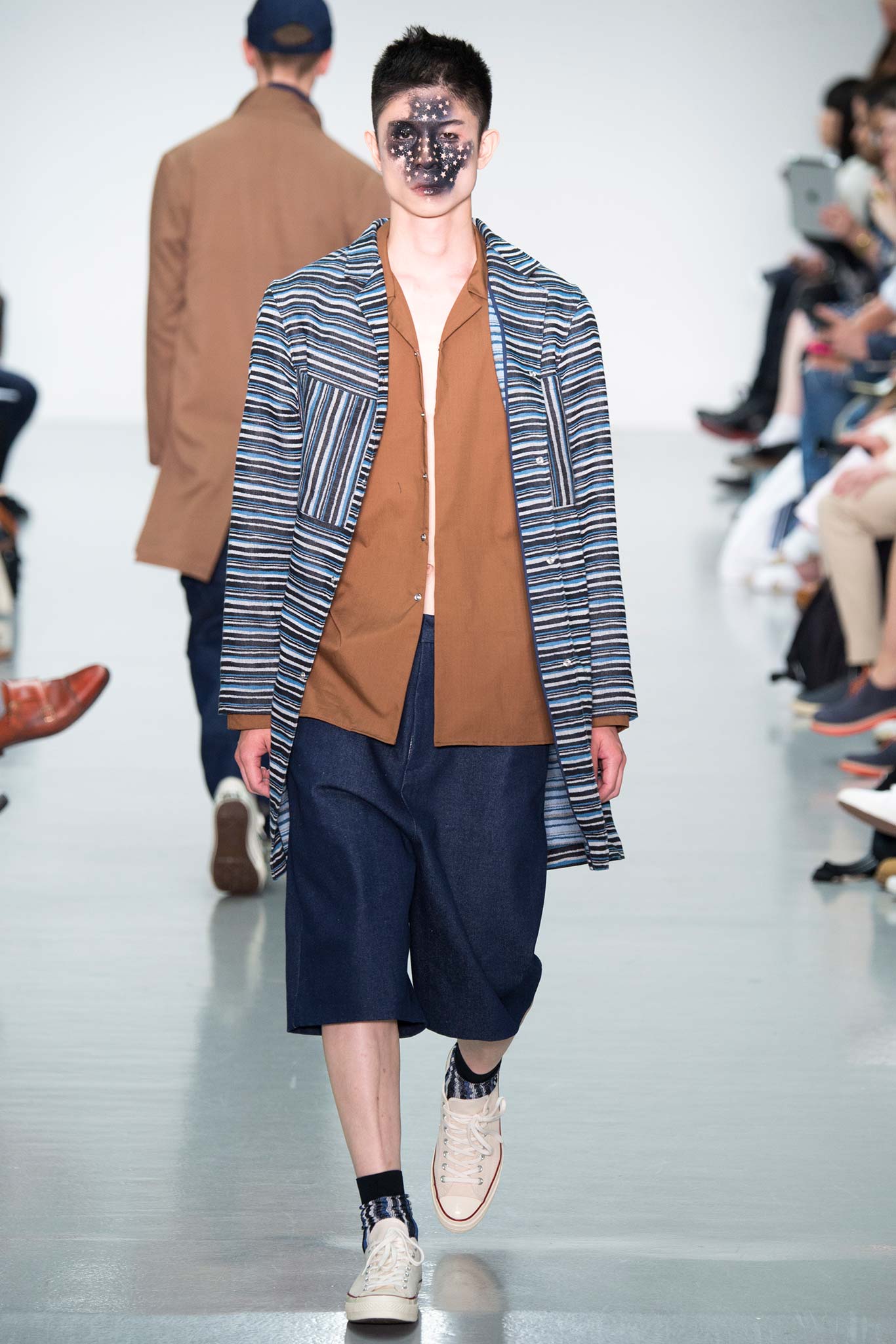 blue striped coat with brown shirt