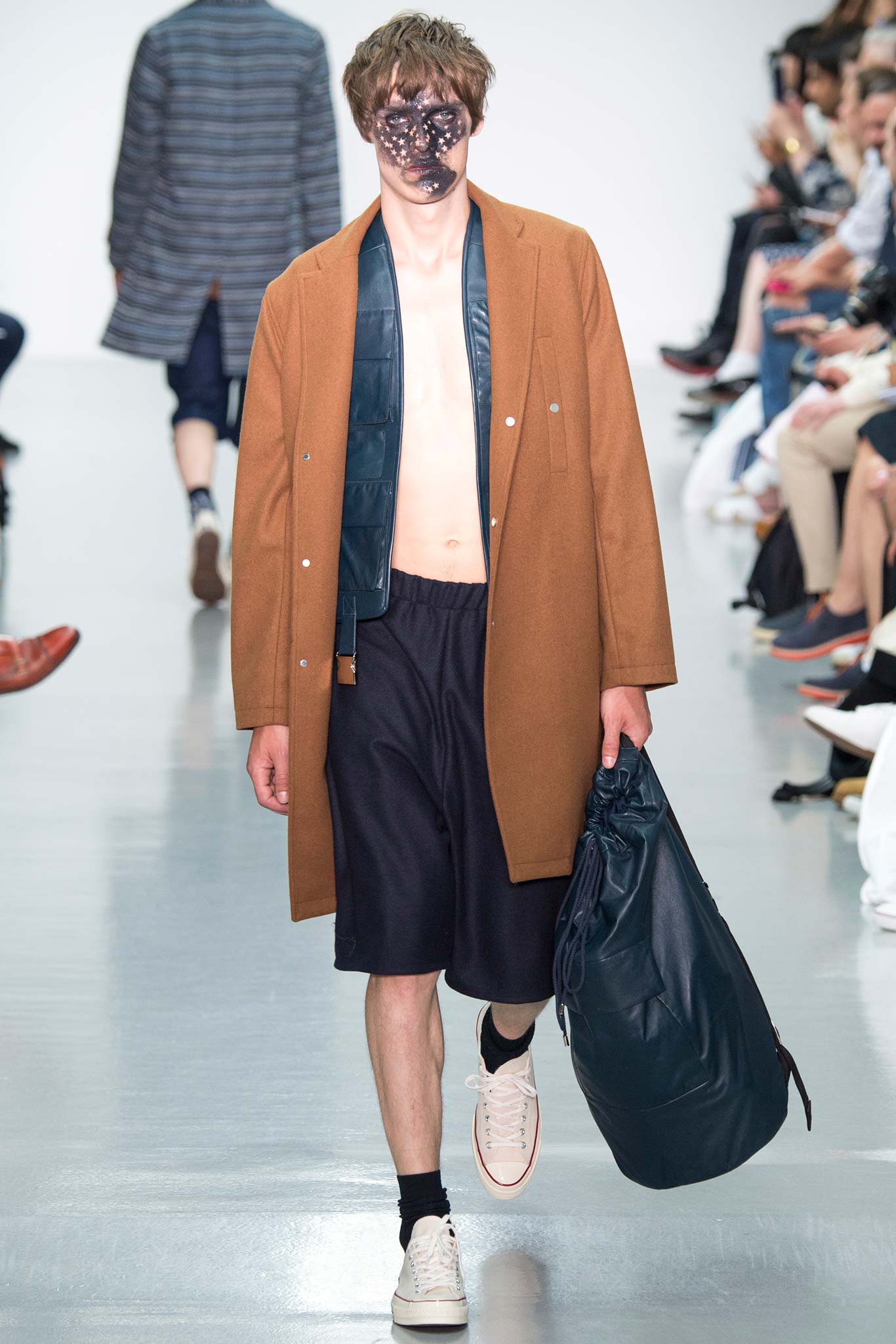brown wool coat with black shorts