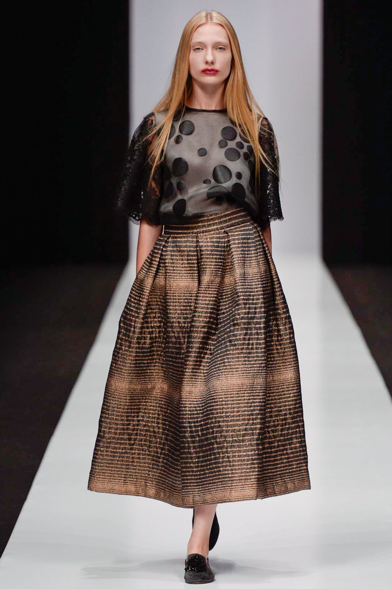 black silk top with gold pleated skirt
