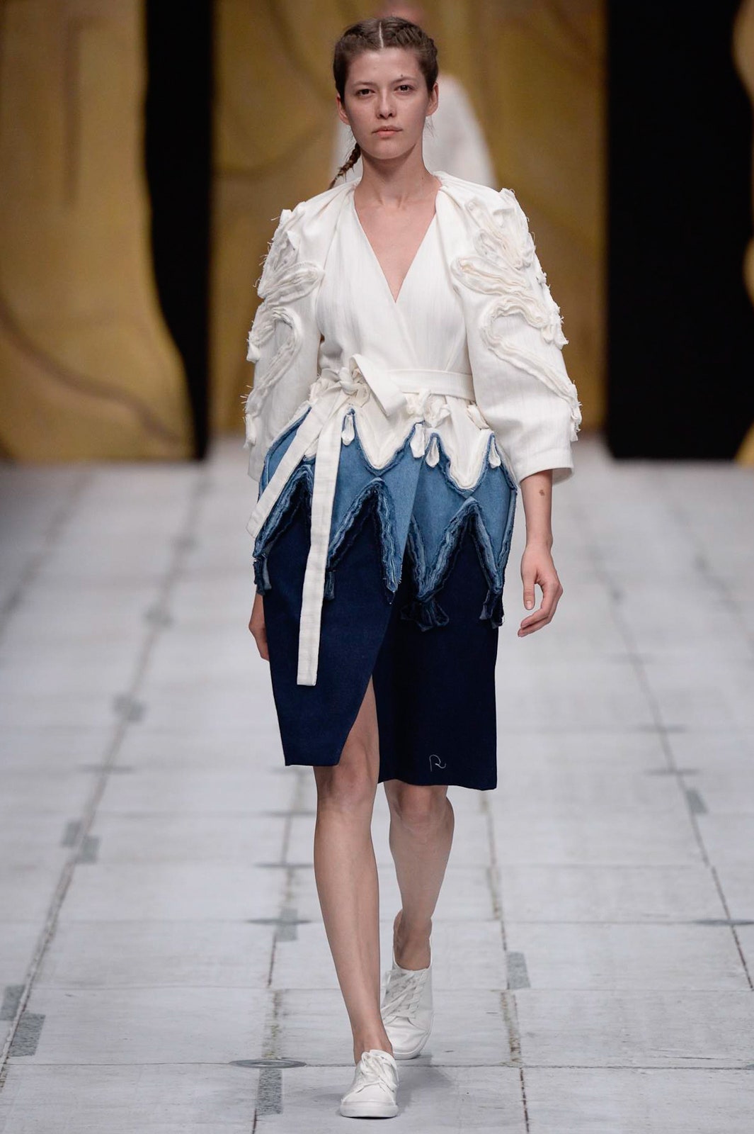 white ruffled top with denim skirt