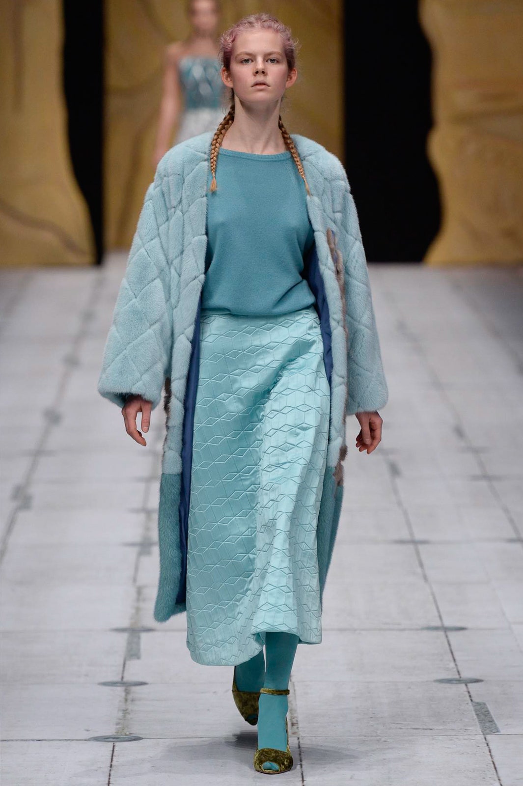 blue quilted coat and midi skirt