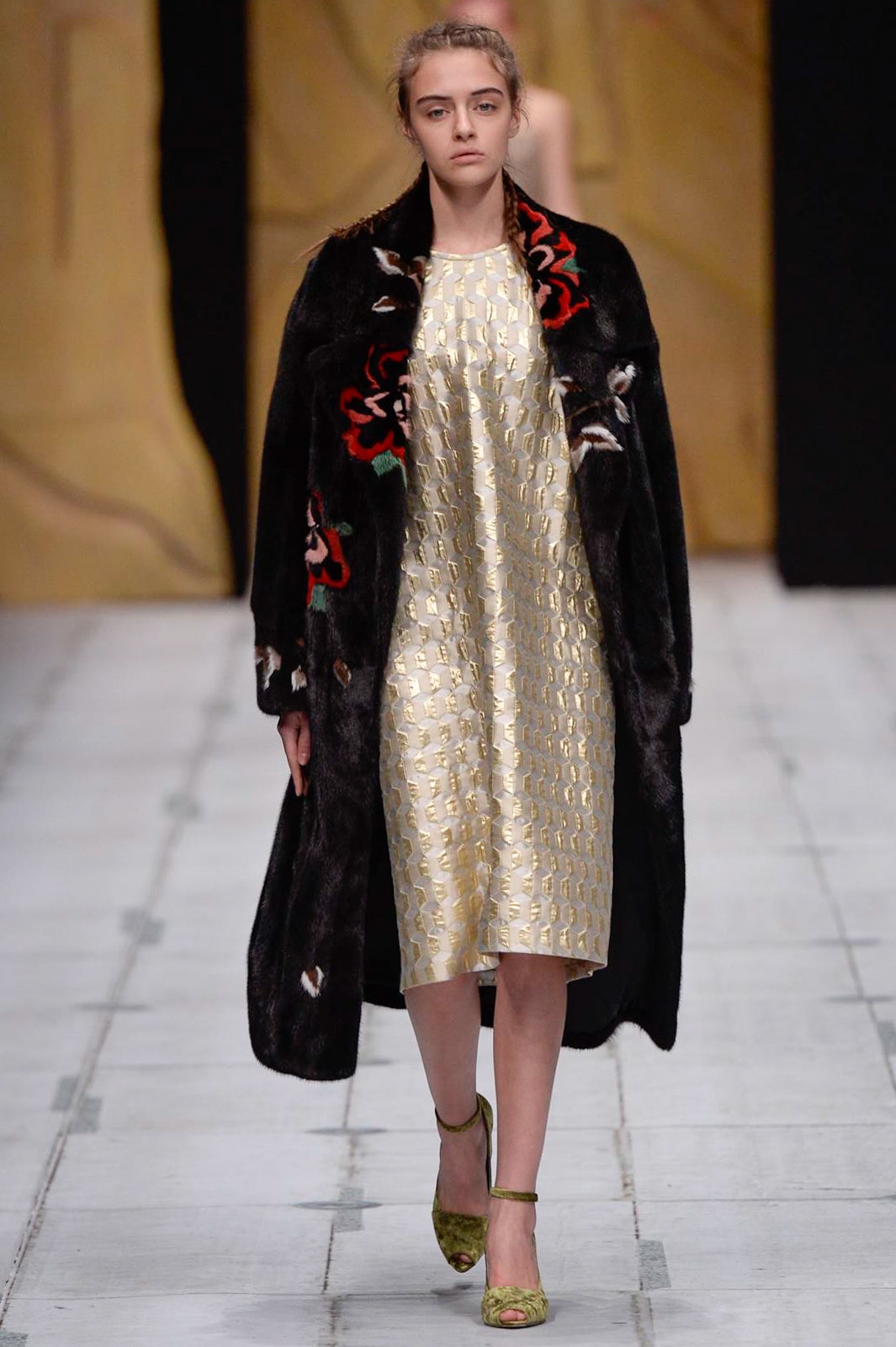 black fur coat and gold dress