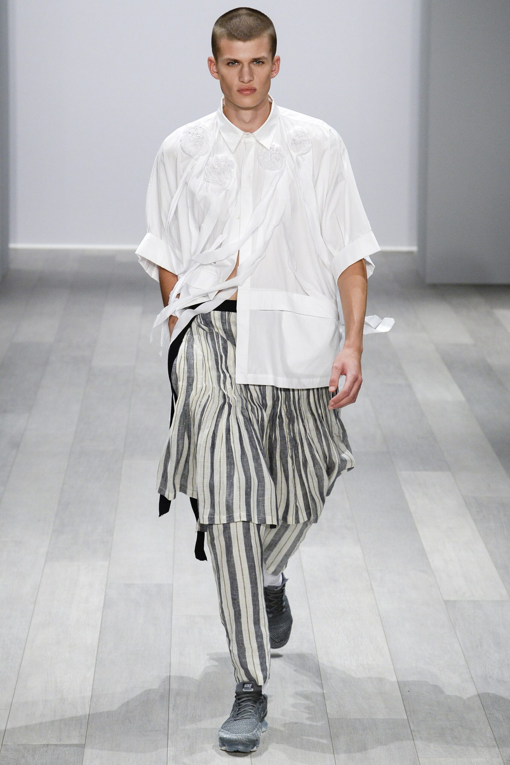 white relaxed shirt with gray striped pants