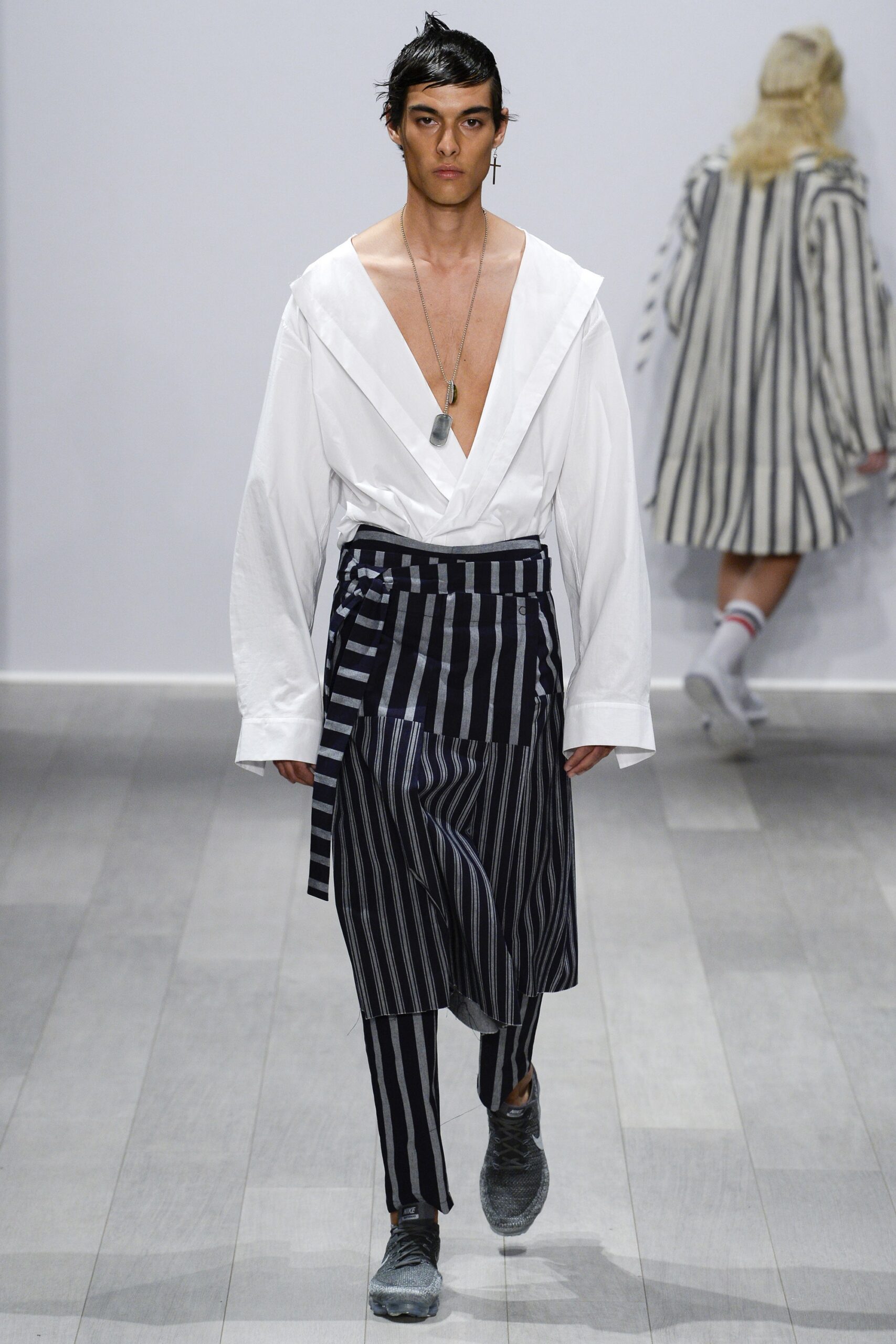 white relaxed shirt with striped pants