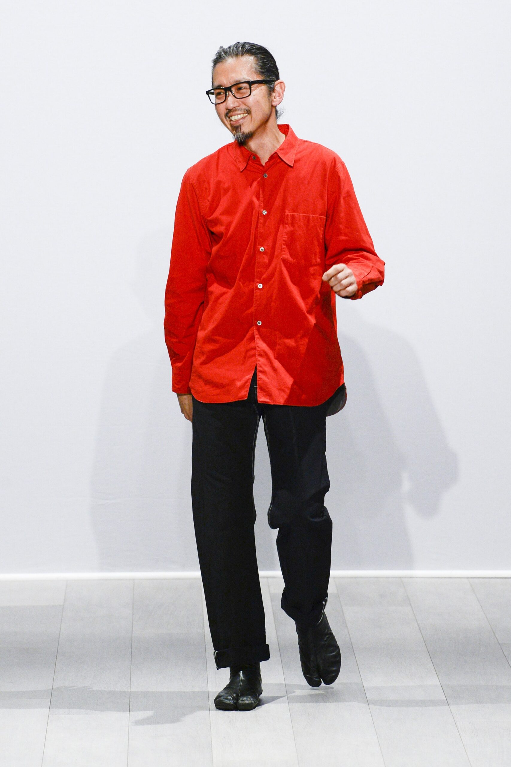red relaxed shirt and black pants