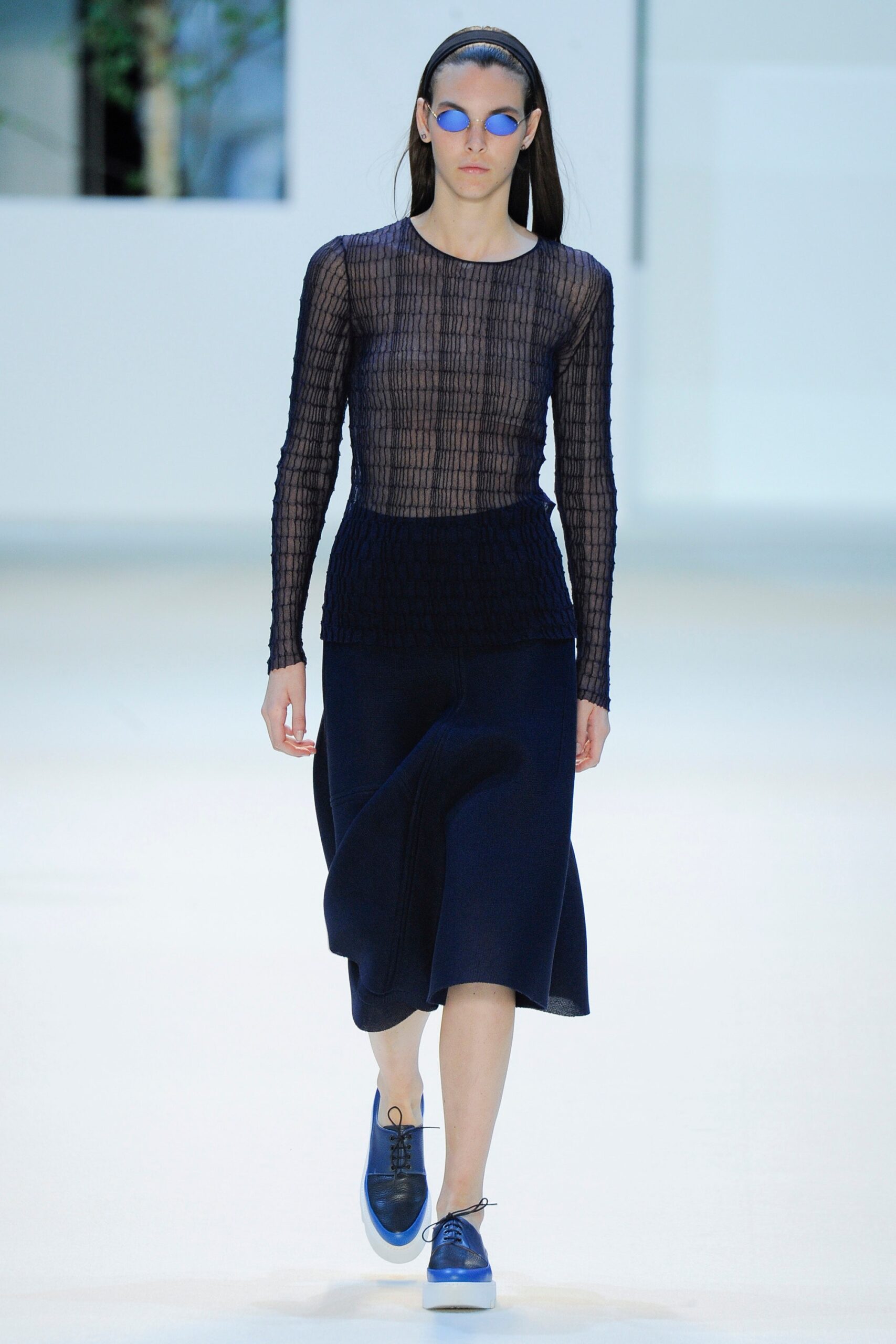 black mesh fitted top with navy skirt