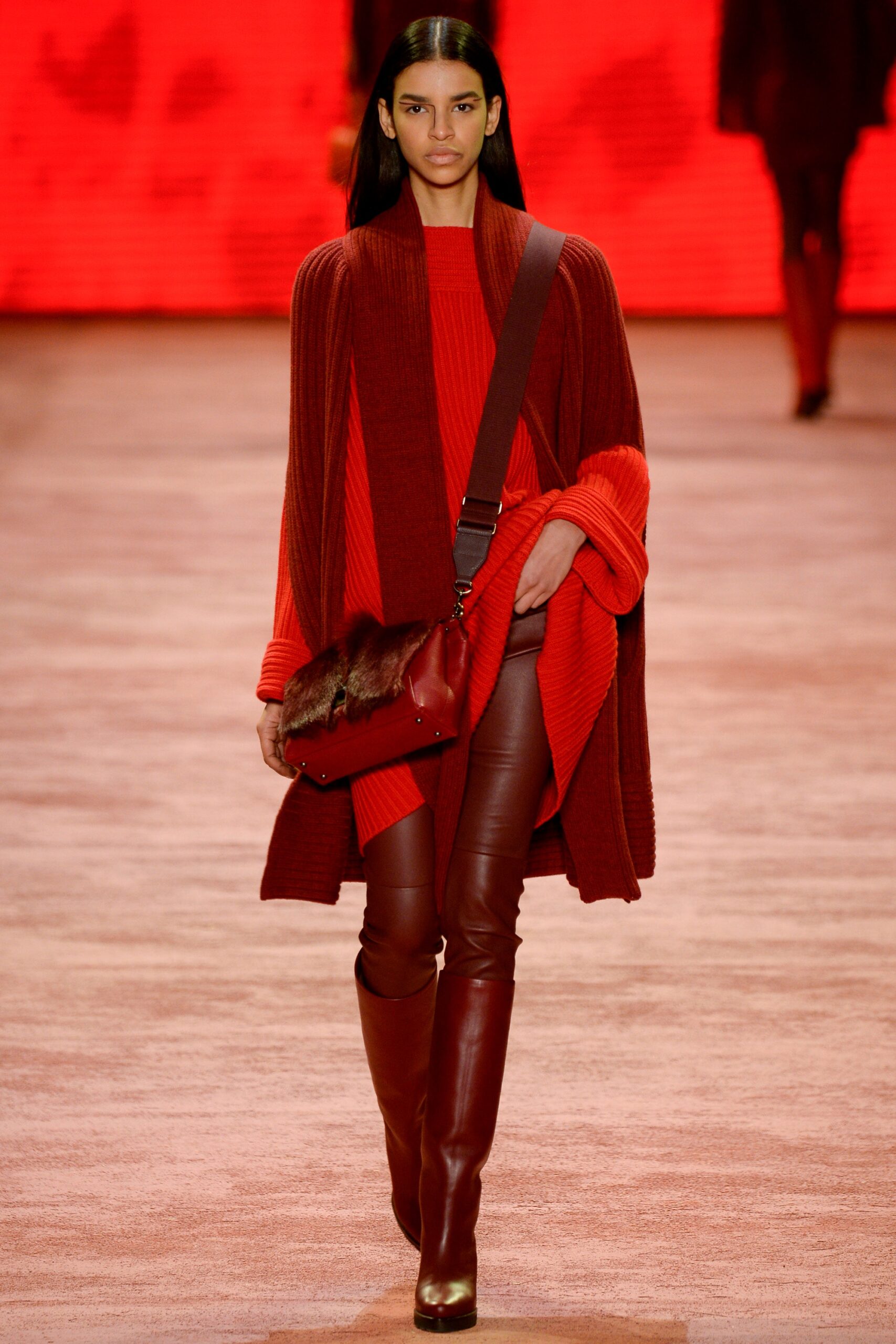 red wool long-sleeve collared oversized draped coat