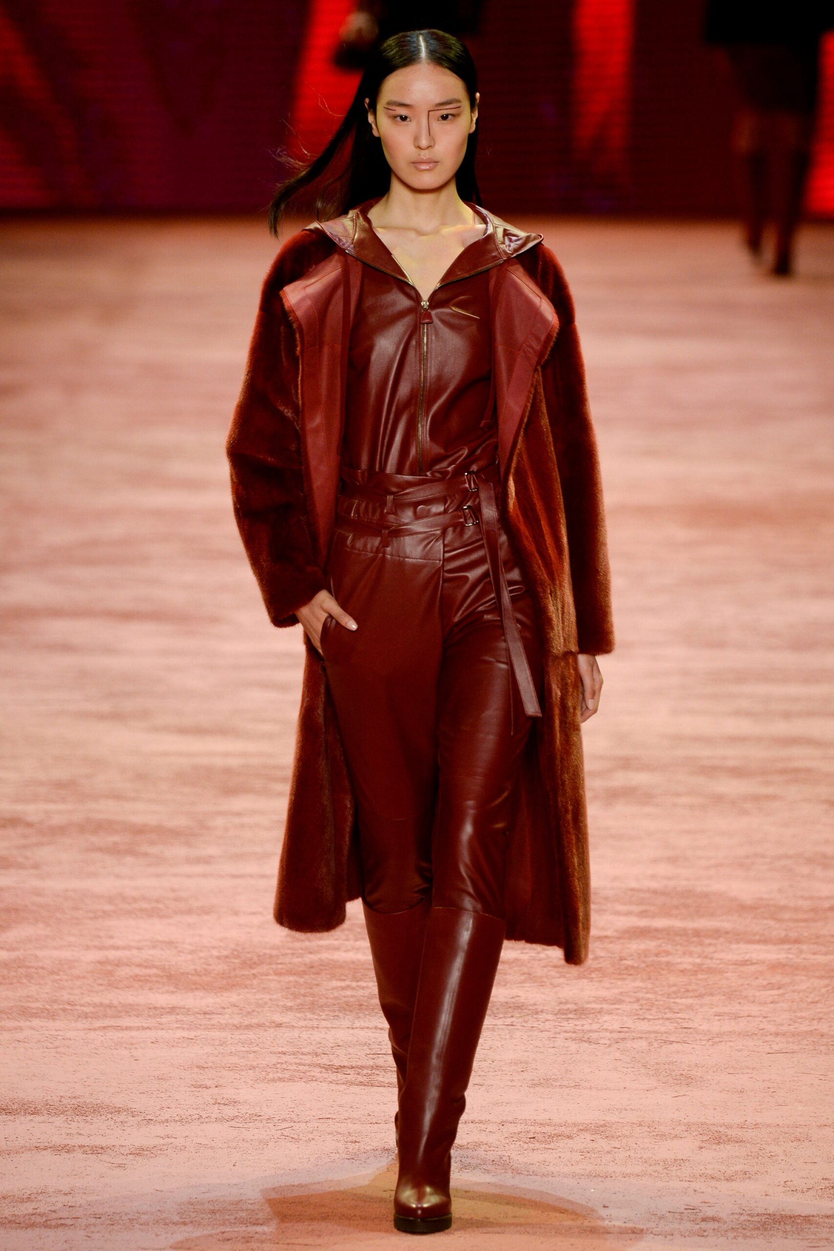 brown fur coat and red leather jumpsuit