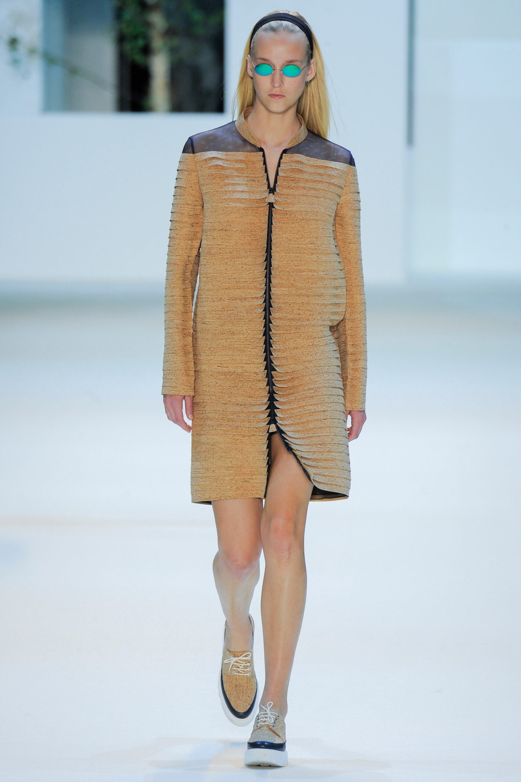 beige fitted coat with pleats