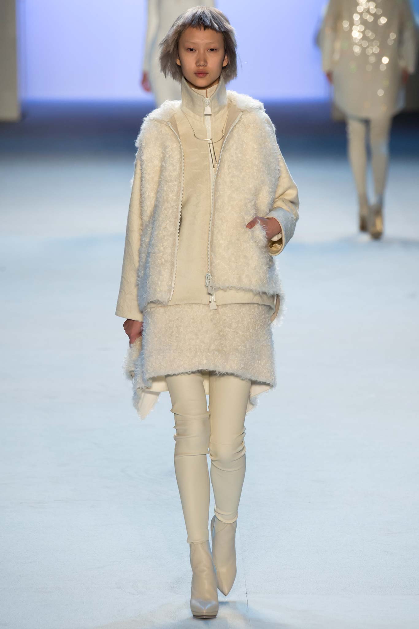 white faux-fur coat and fitted top